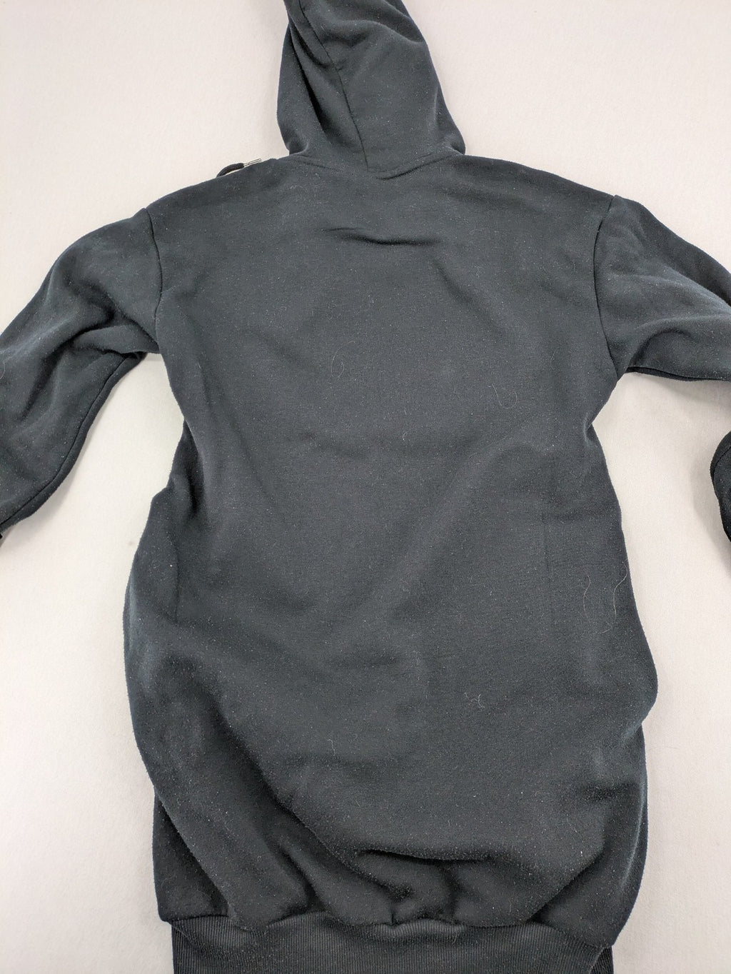 One Piece long hoodie black featuring Trafalgar Law's Jolly-Roger logo and drawstring hood.
