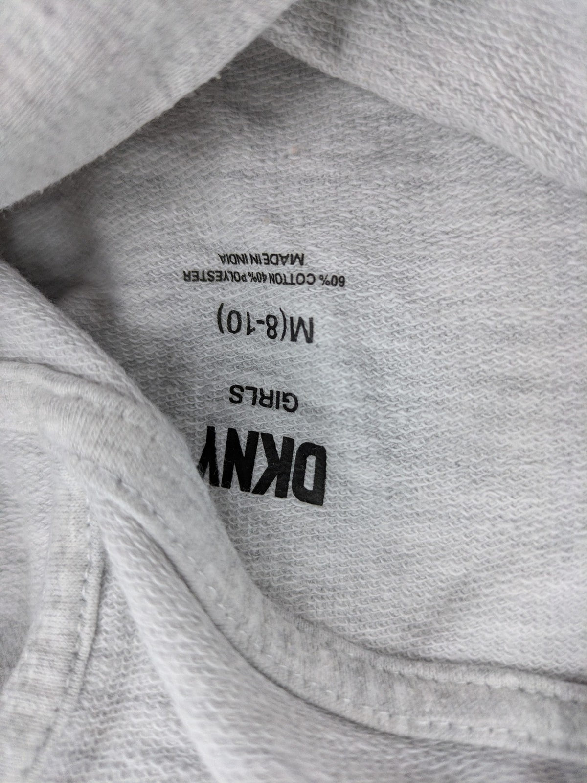 DKNY pink hoodie dress colorblock design with glitter logo and short sleeves.