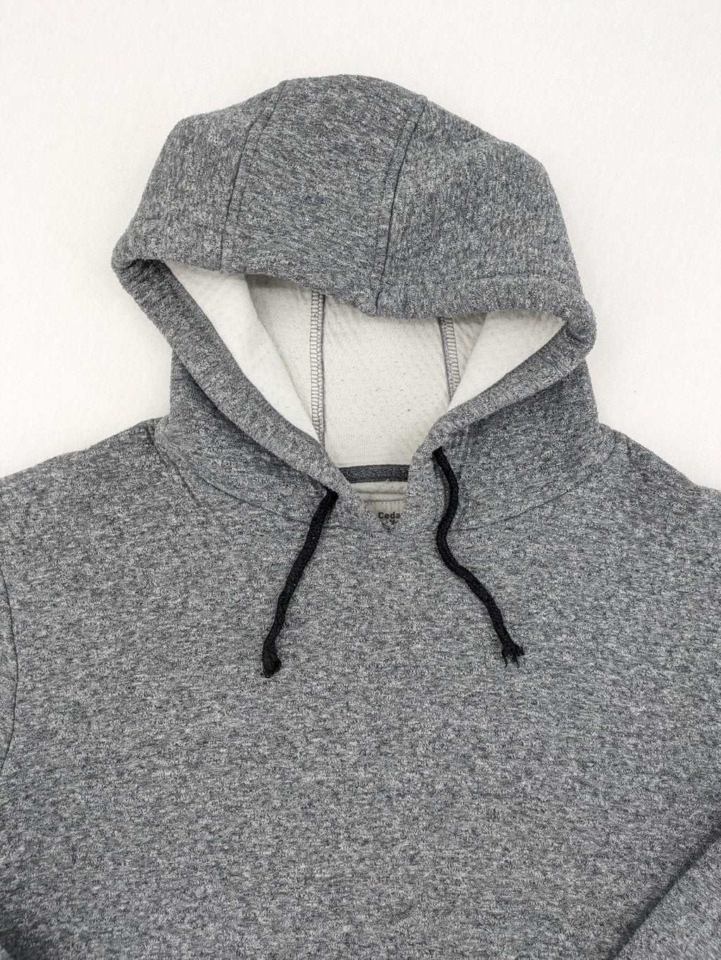 Cedarwood State grey pullover hoodie with adjustable drawstring hood and kangaroo pocket.