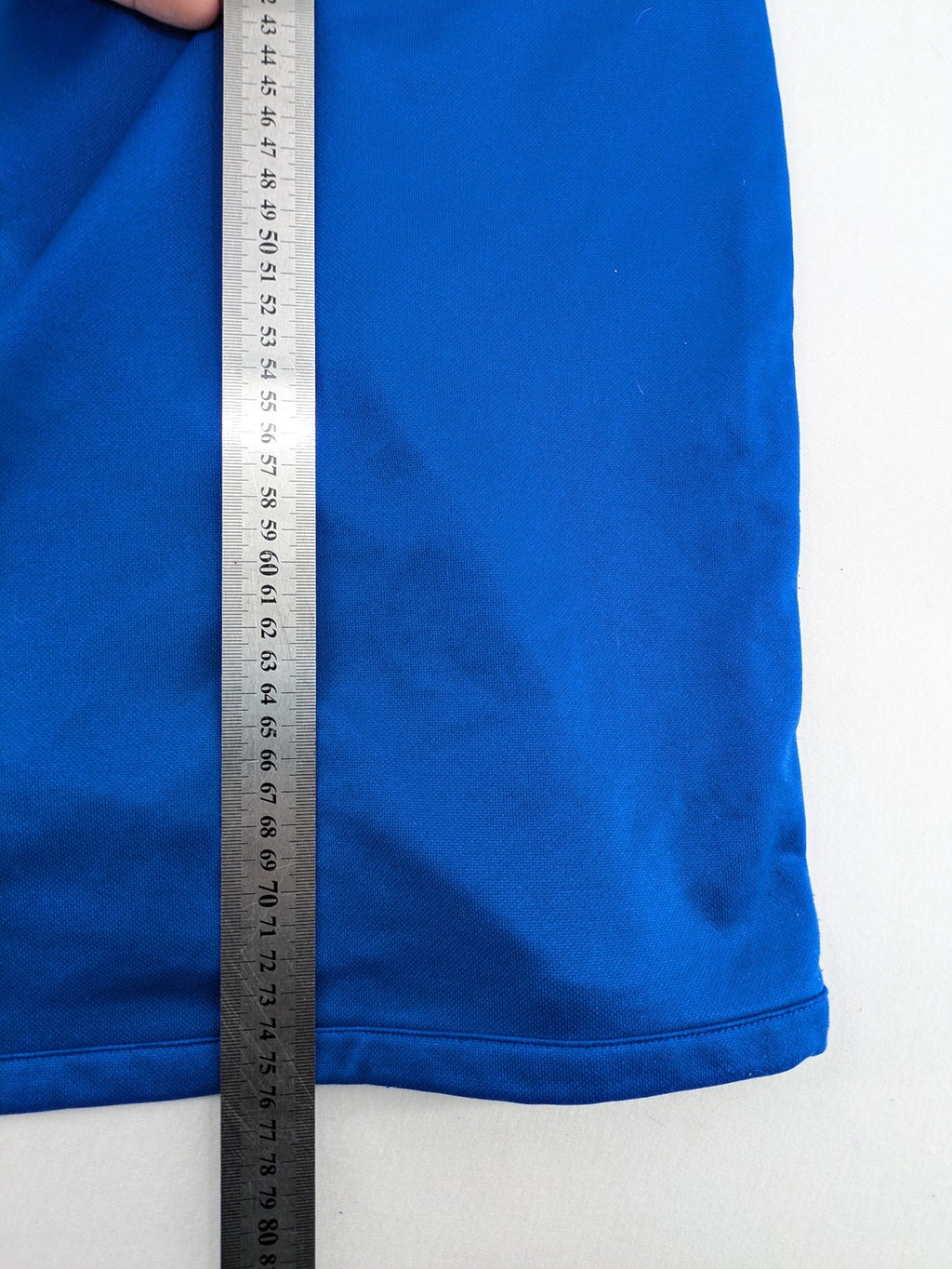 Adidas blue long sleeve top with white three stripes and 1/4 zip collar.