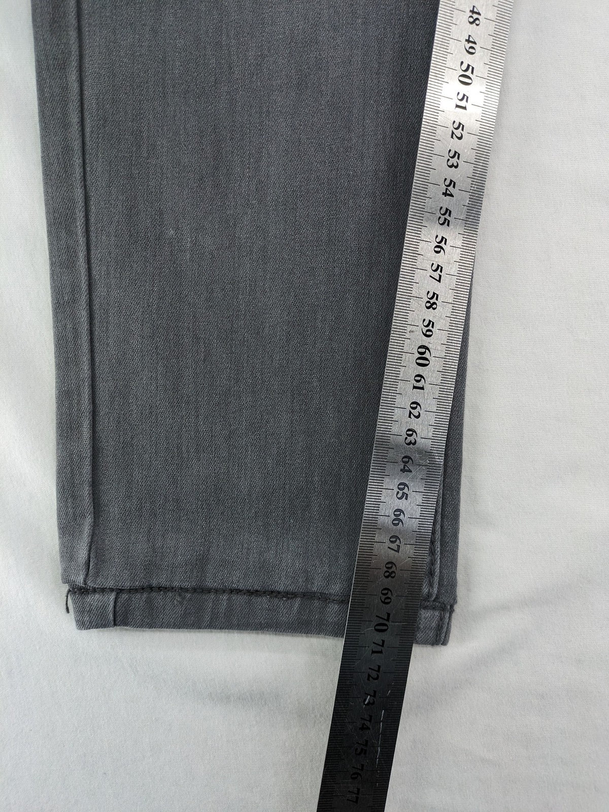Born Rich grey slim fit jeans with button fly and washed denim texture.