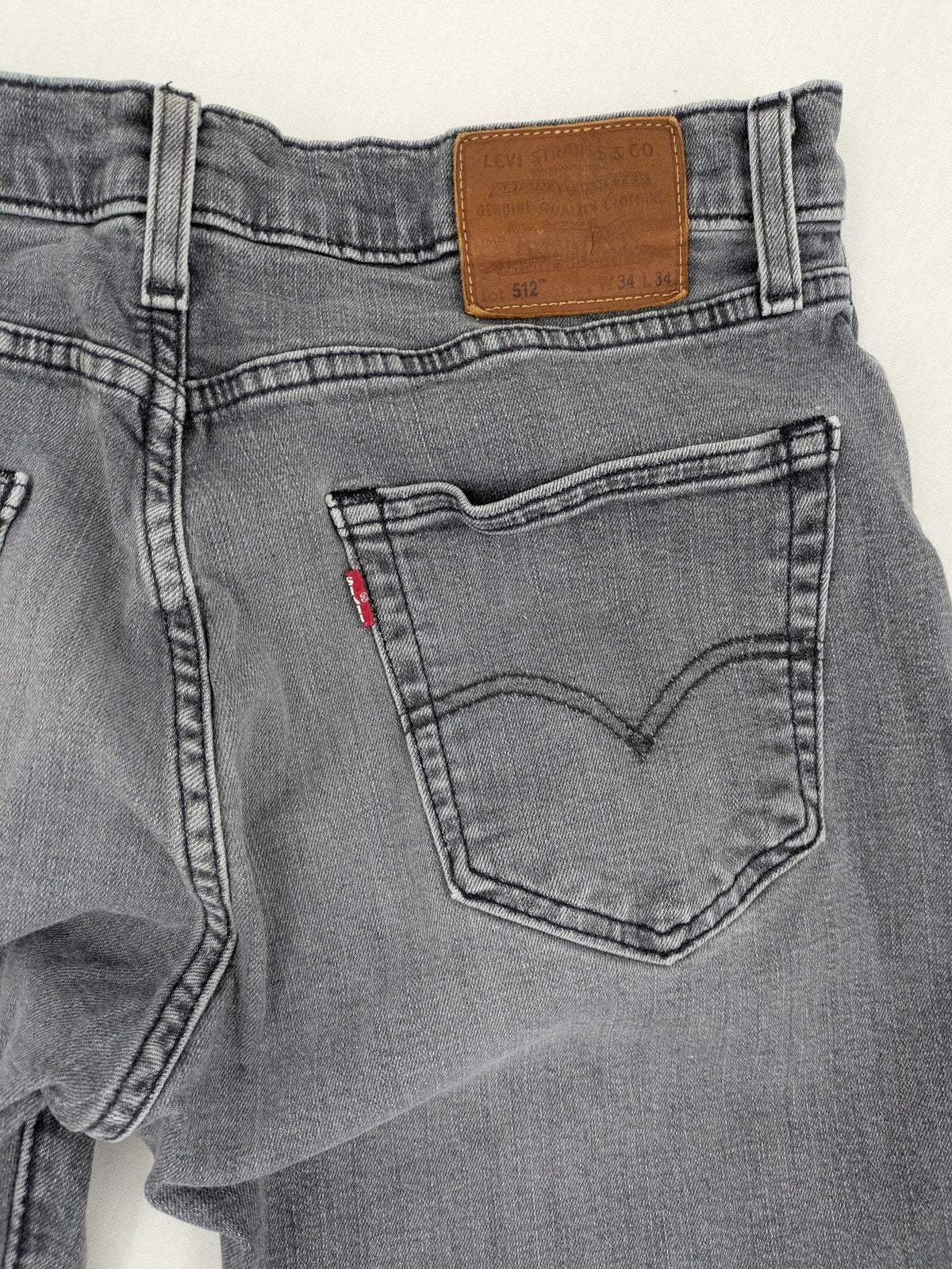 Levi's red straight jeans with classic 5-pocket design and slim taper fit.