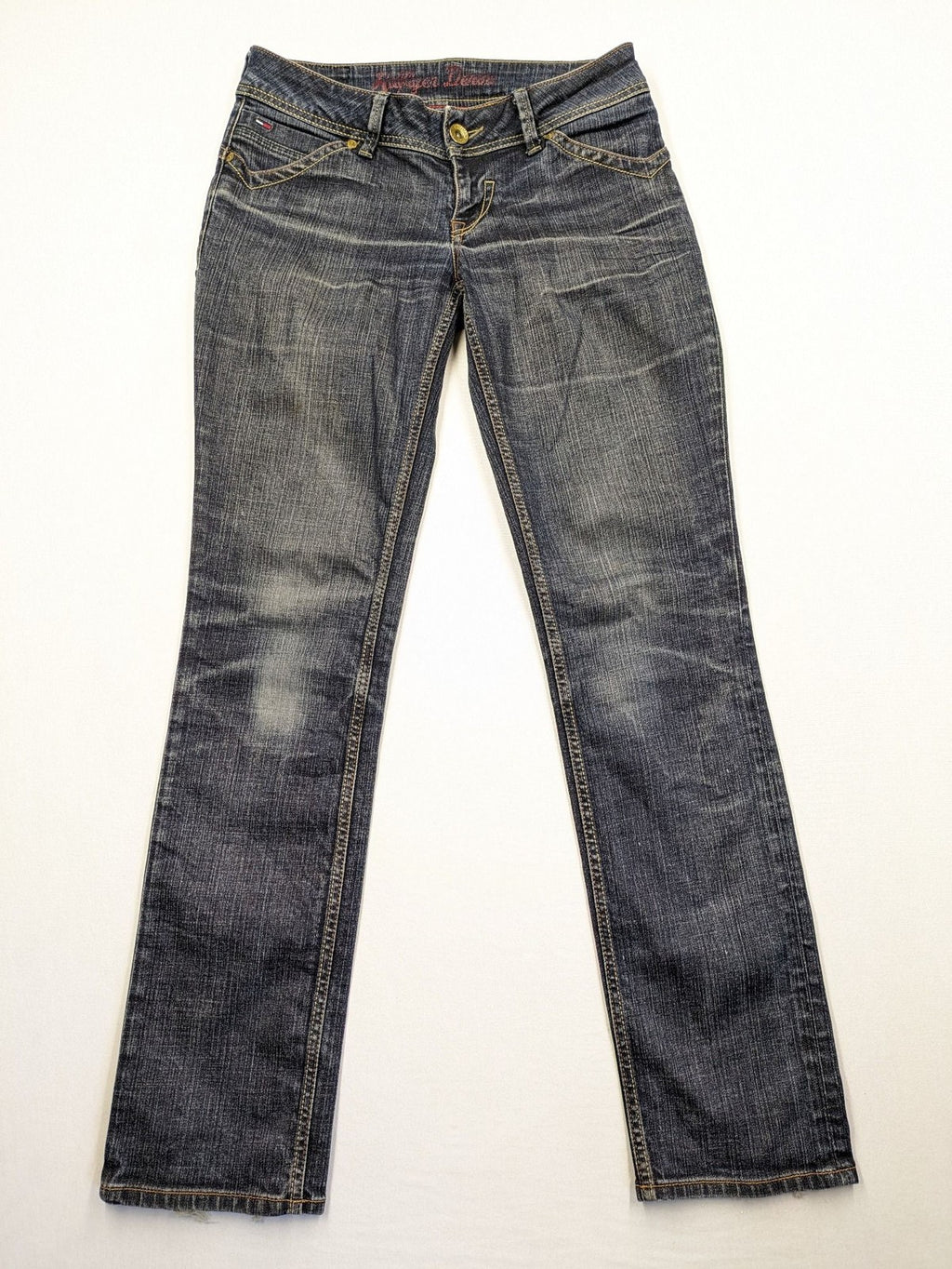Tommy Hilfiger Denim blue straight jeans with low rise and slight used effects.