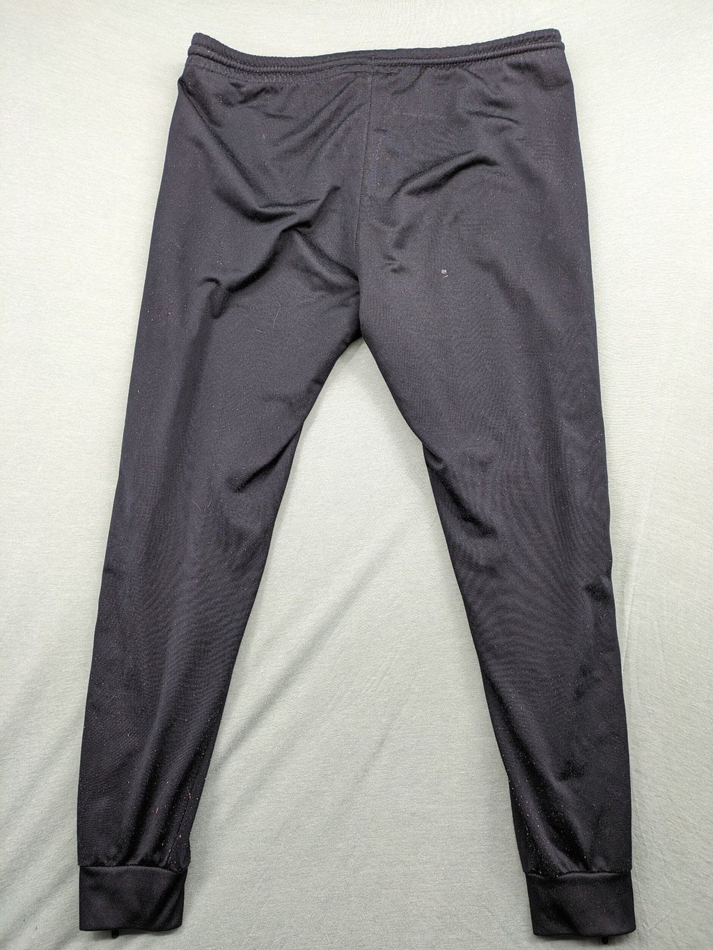 Jako black training pants size L with zippered pockets and elastic waistband.