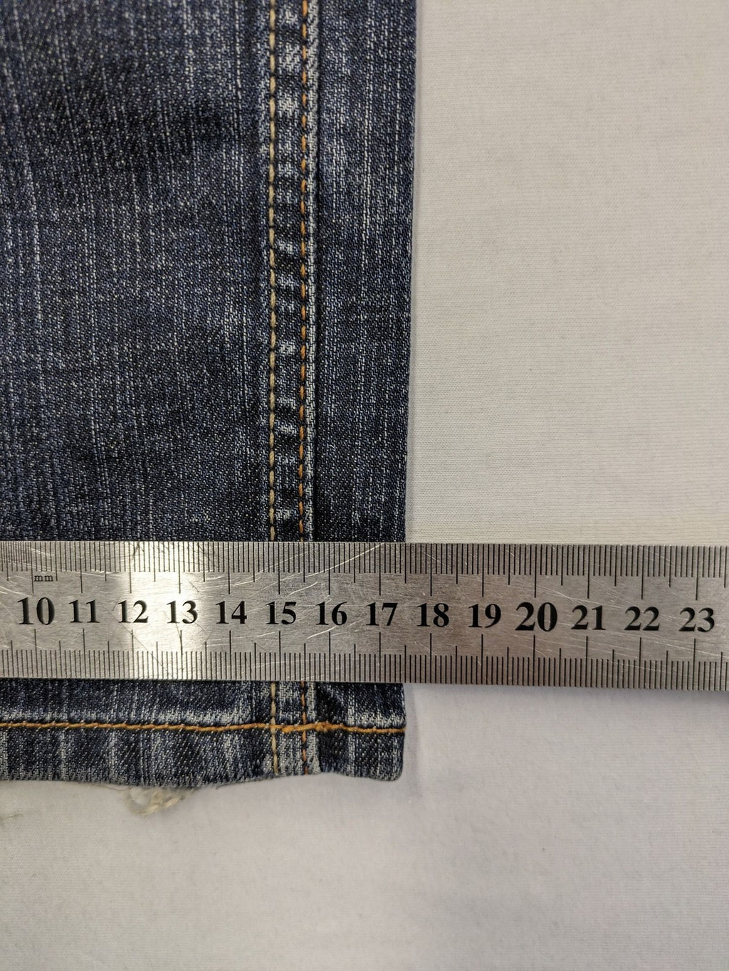 Tommy Hilfiger Denim blue straight jeans with low rise and slight used effects.