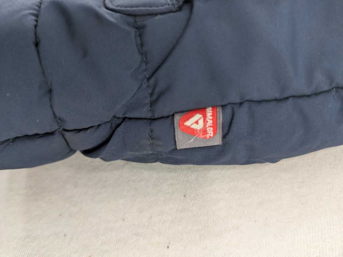 Jack Wolfskin cream and navy puffer coat with quilted design and Sherpa fleece lining.