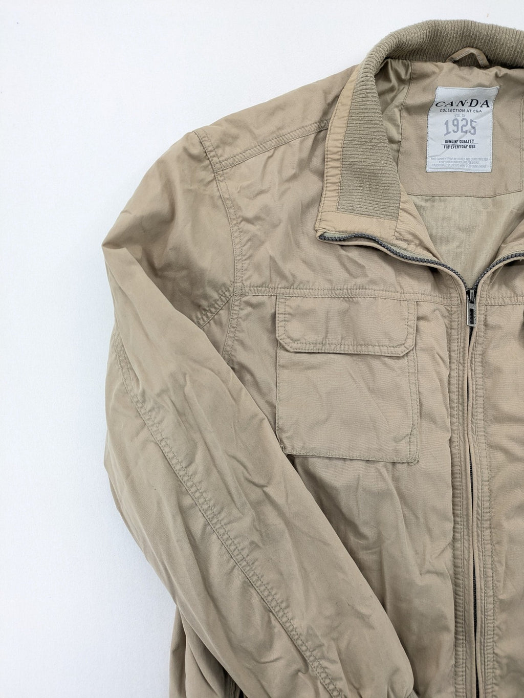 Canda beige bomber jacket full zip with ribbed collar and buttoned chest pockets.