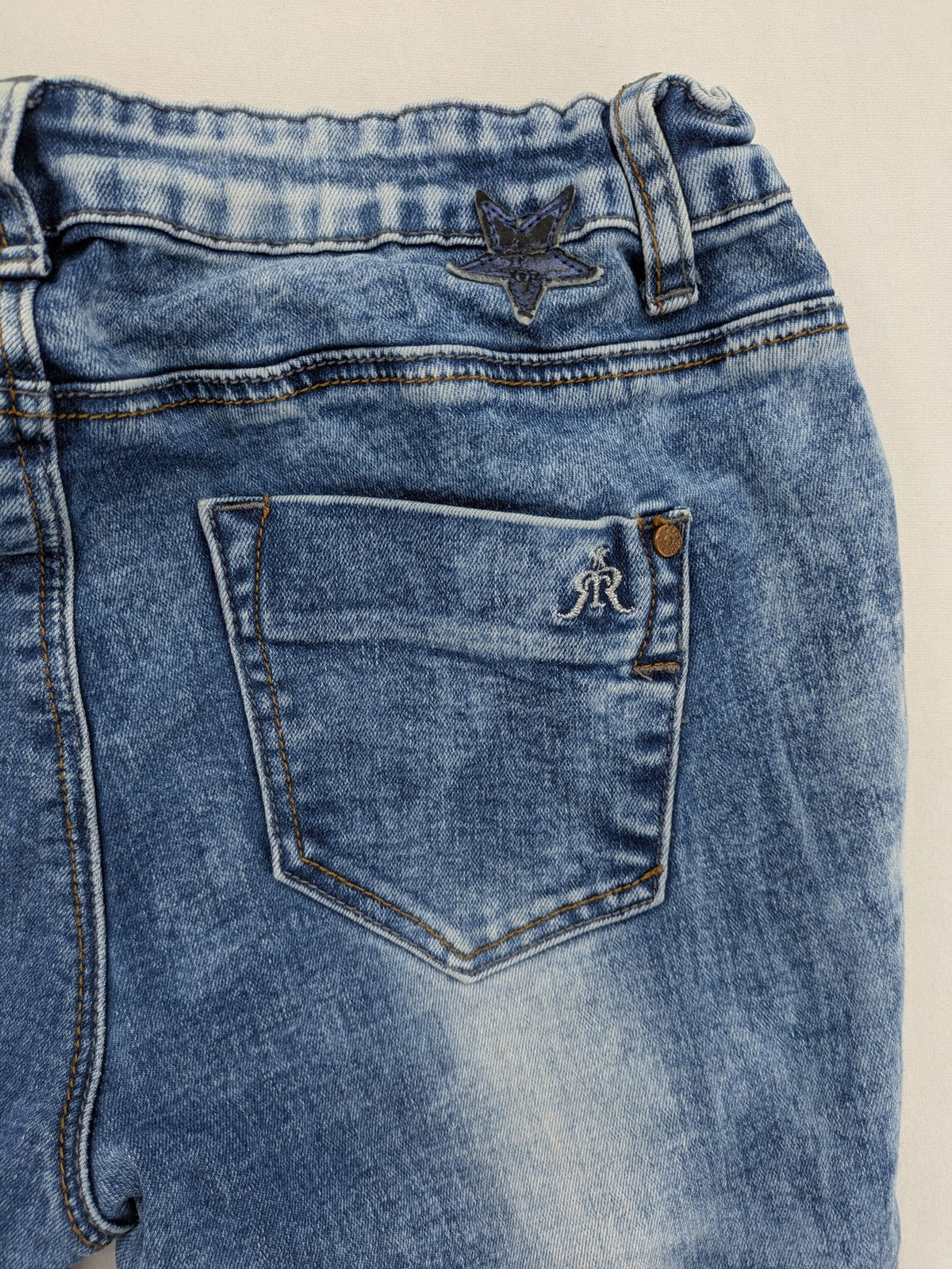 Retour blue slim fit jeans with classic 5-pocket style and adjustable waistband.
