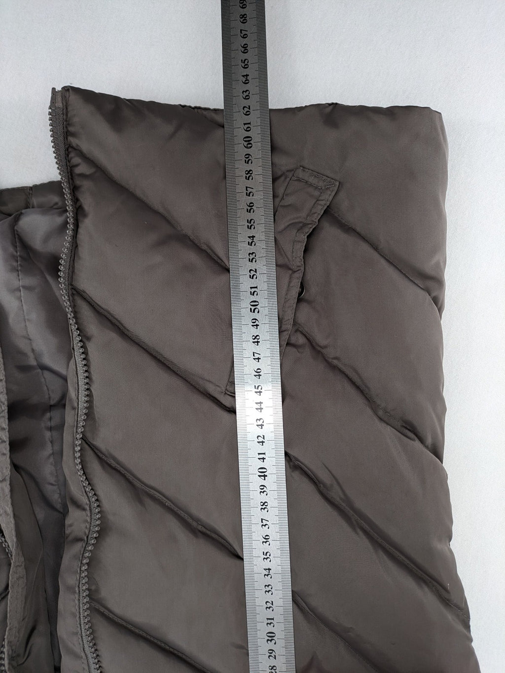 L&A Fashion grey puffer vest with zip closure, stand collar, and side pockets.