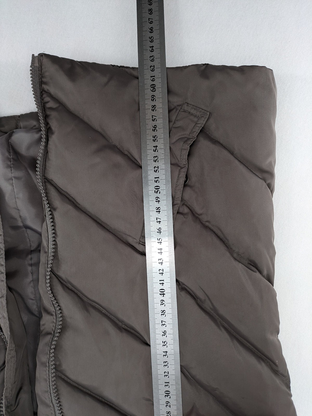L&A Fashion grey puffer vest with zip closure, stand collar, and side pockets.