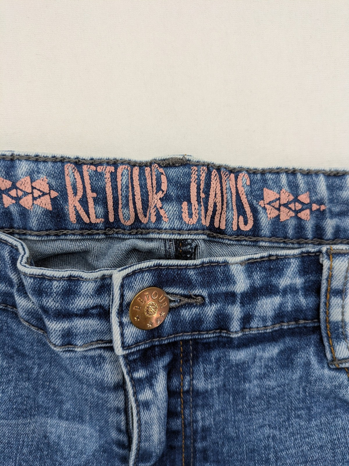 Retour blue slim fit jeans with classic 5-pocket style and adjustable waistband.