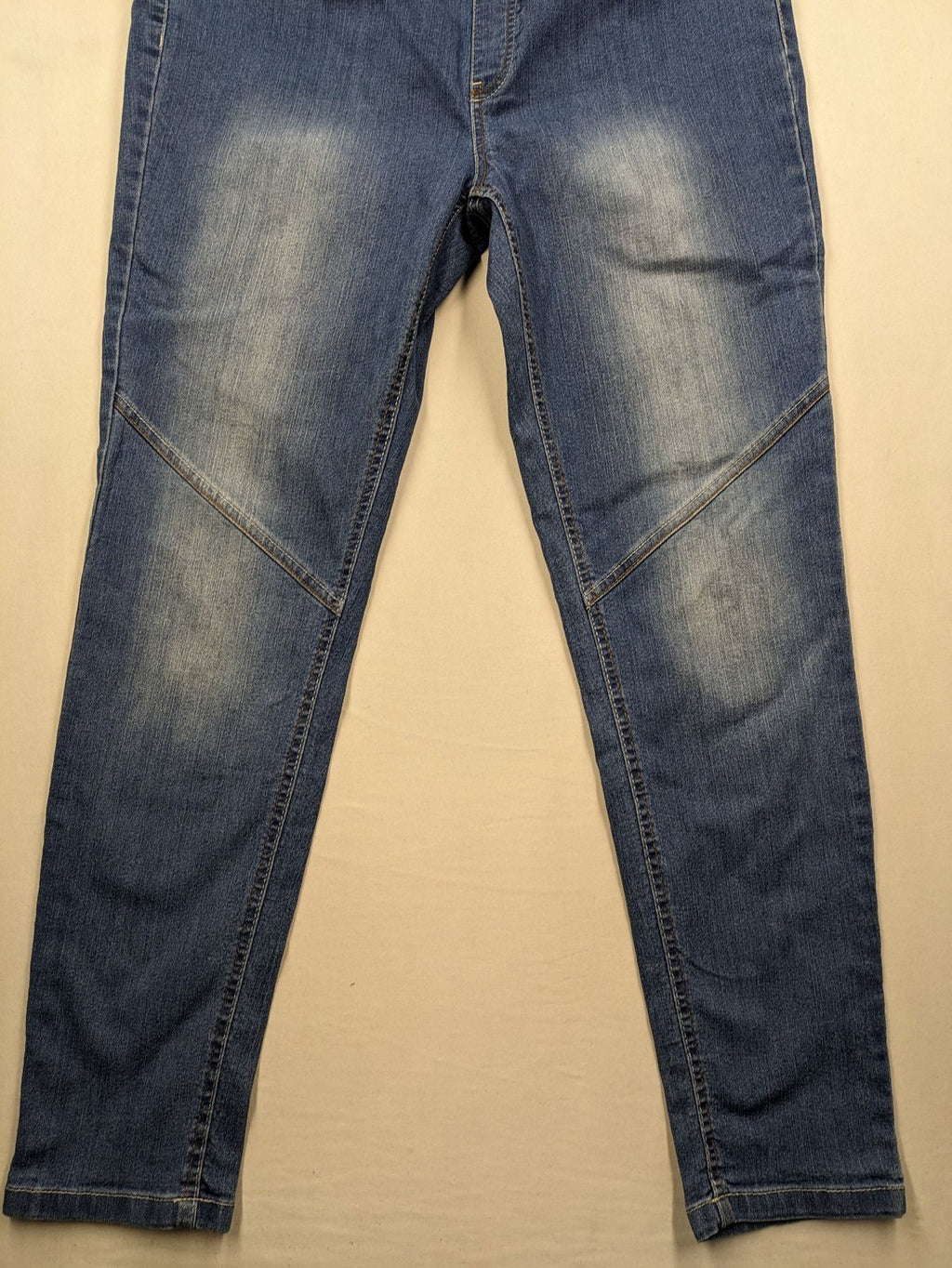Rainbow blue straight jeans with elastic waistband and decorative knee stitching.
