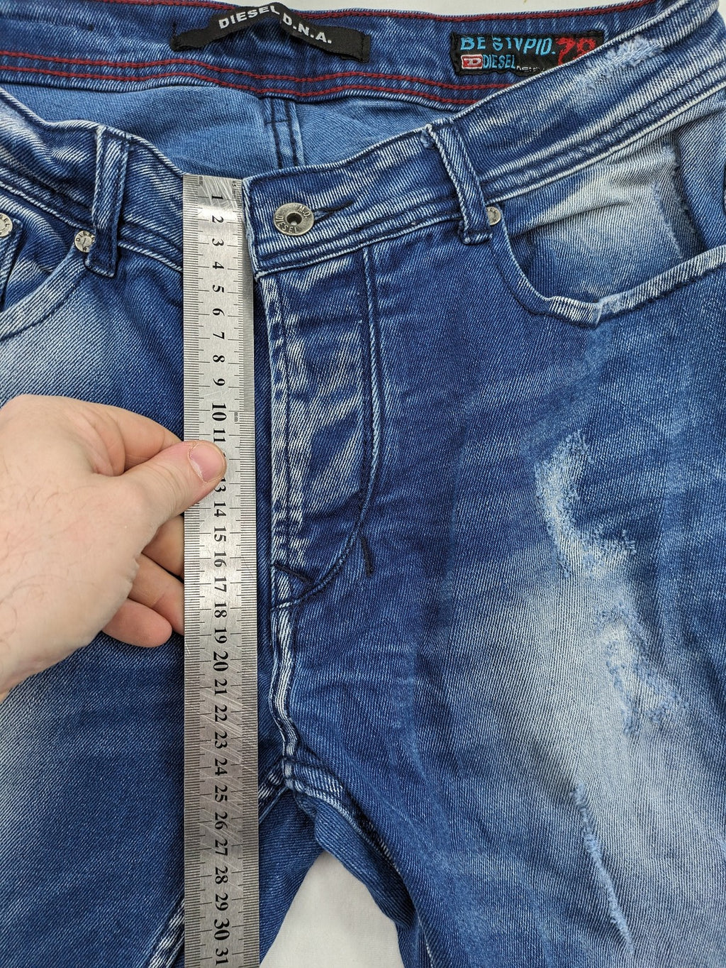 Diesel blue straight jeans with distressed details and ripped accents, made of cotton.