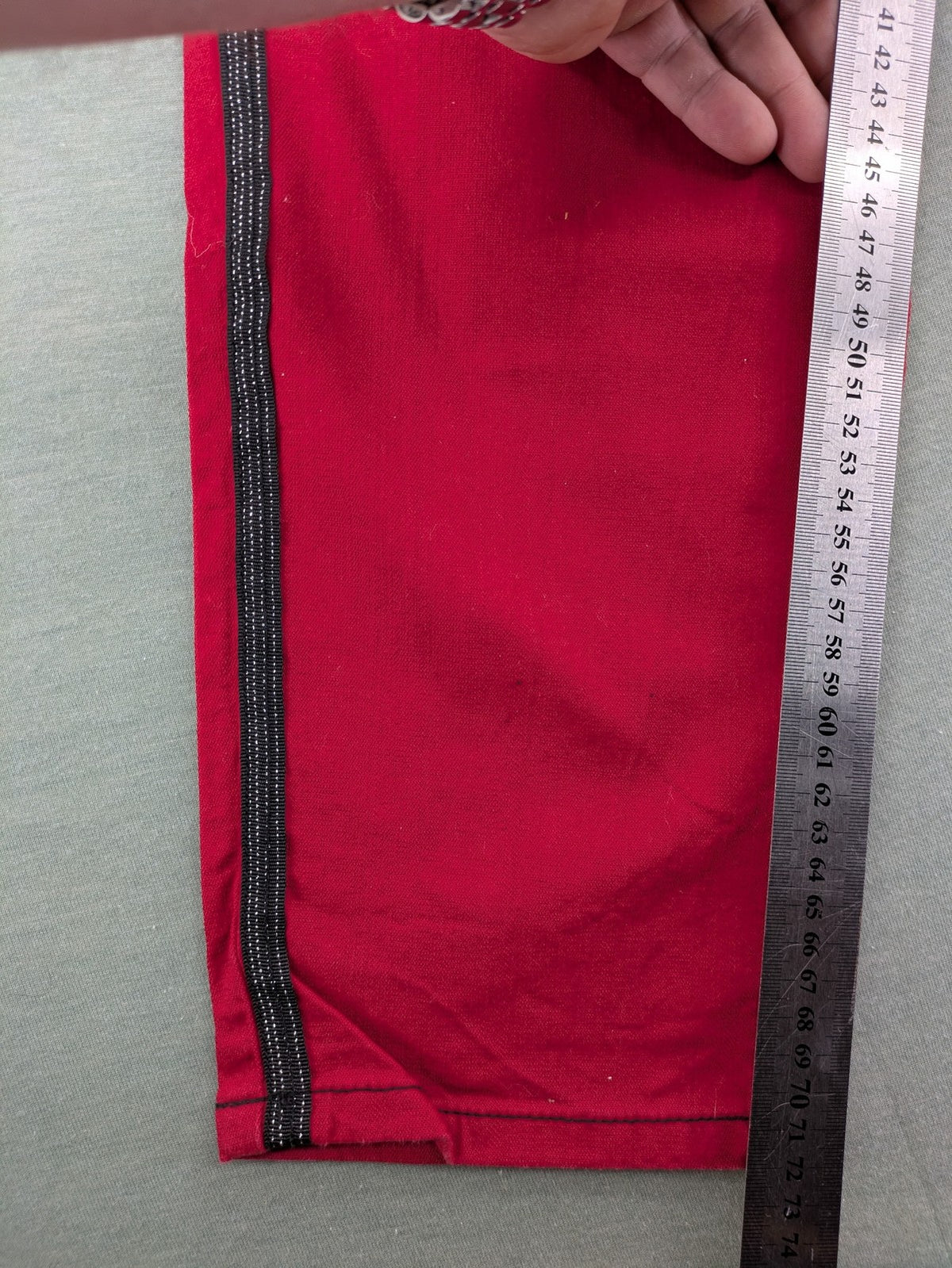 Ambria red straight jeans with black side stripe, classic five-pocket design, stretch cotton blend.