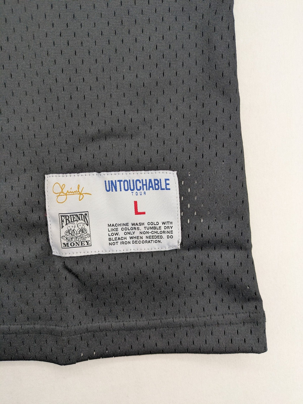 Friends With Money blue basketball jersey black mesh with stylized graphic and number "1