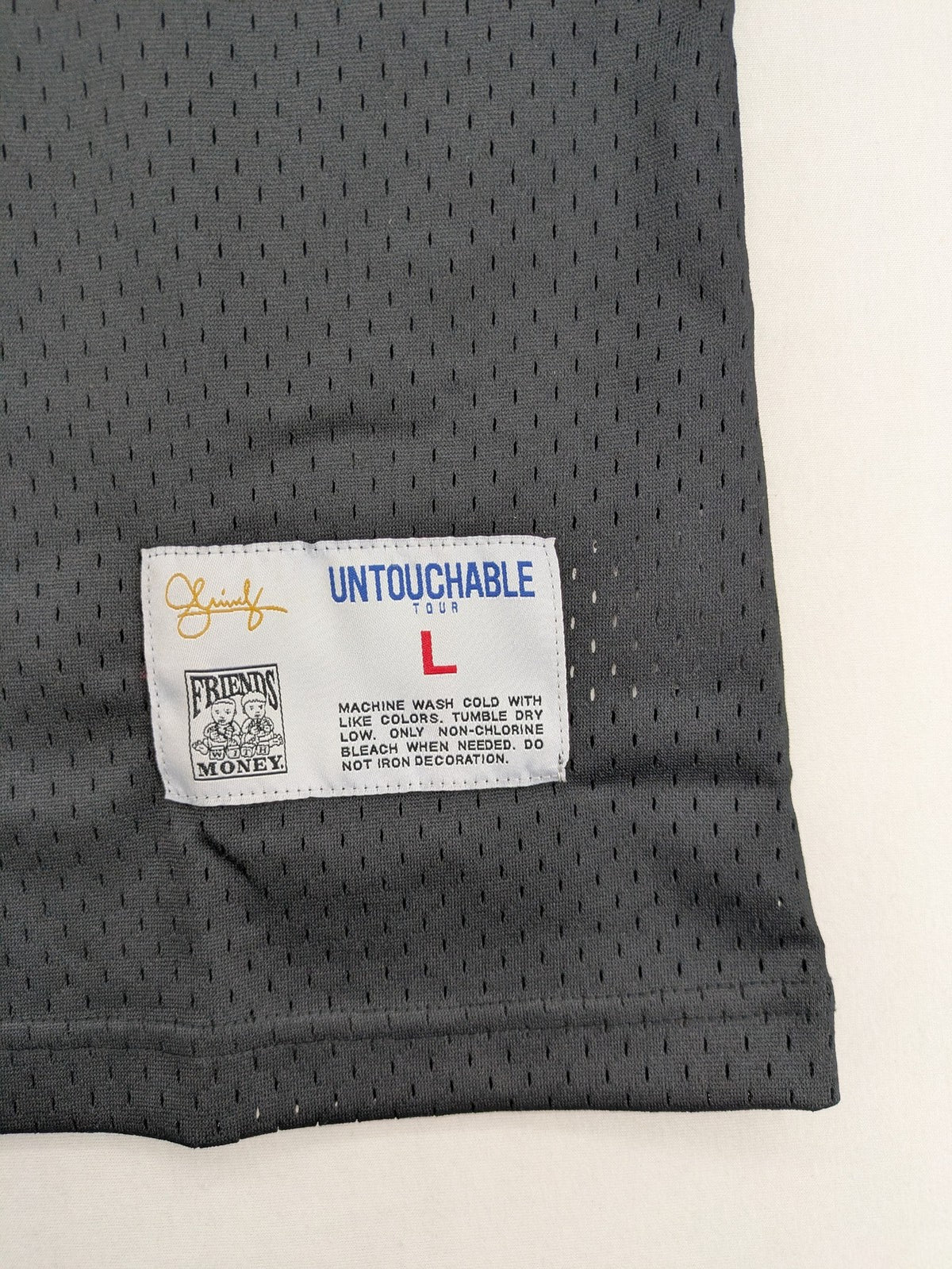 Friends With Money blue basketball jersey black mesh with stylized graphic and number "1