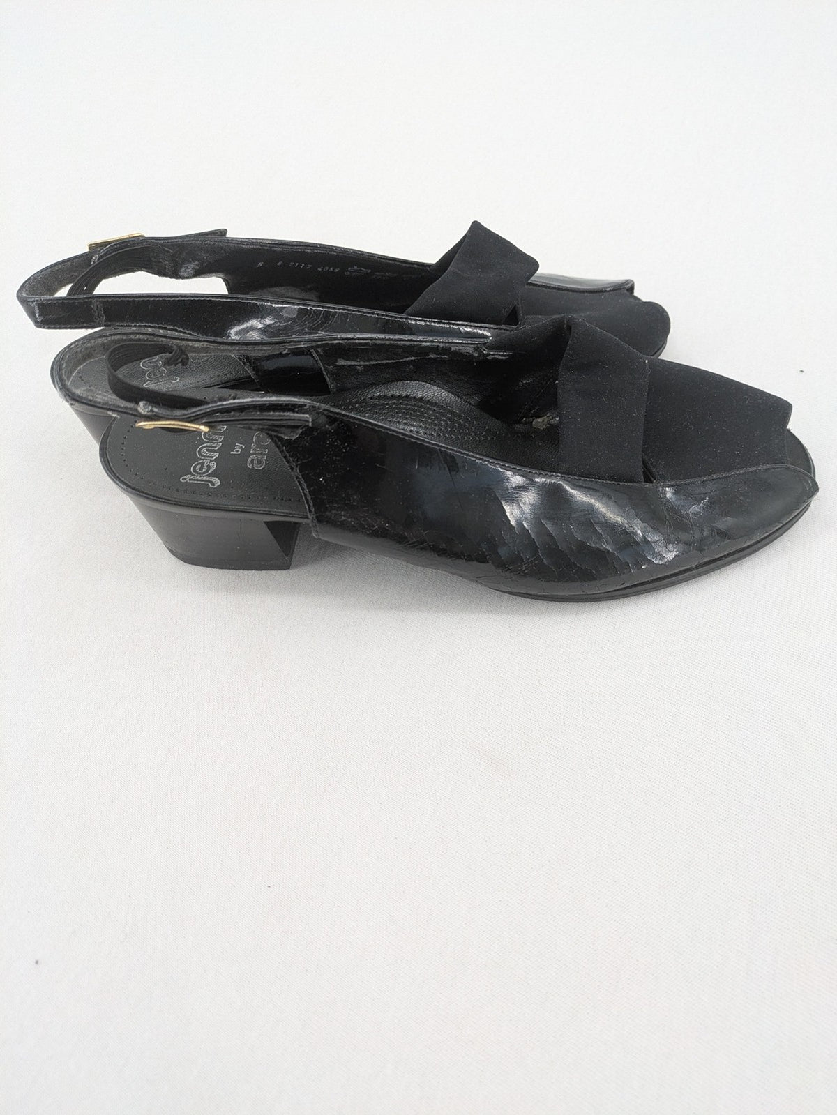 Jenny by Ara black slingback pumps with peep-toe front and glossy finish.