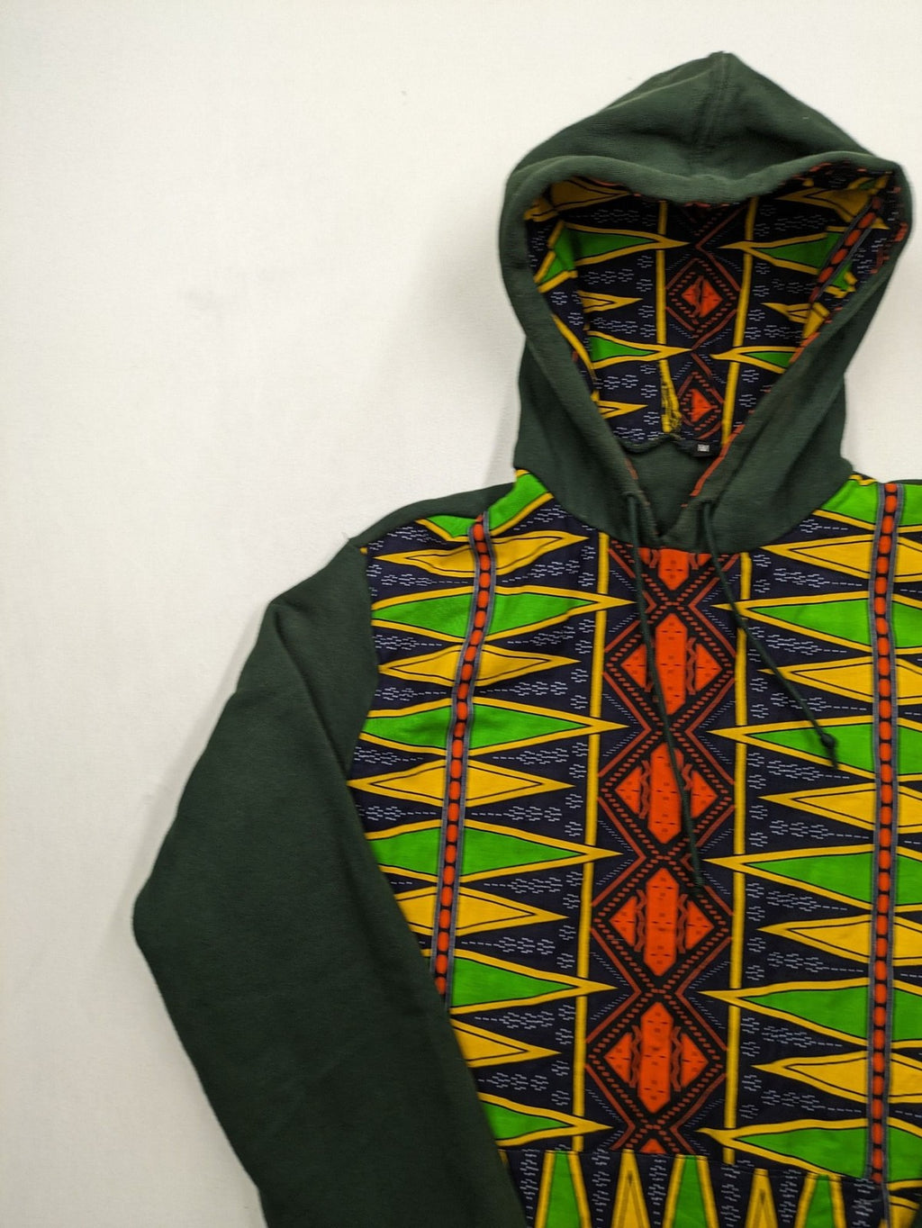 Diweye Creations multi turtle neck jumper with vibrant African print and soft green material.