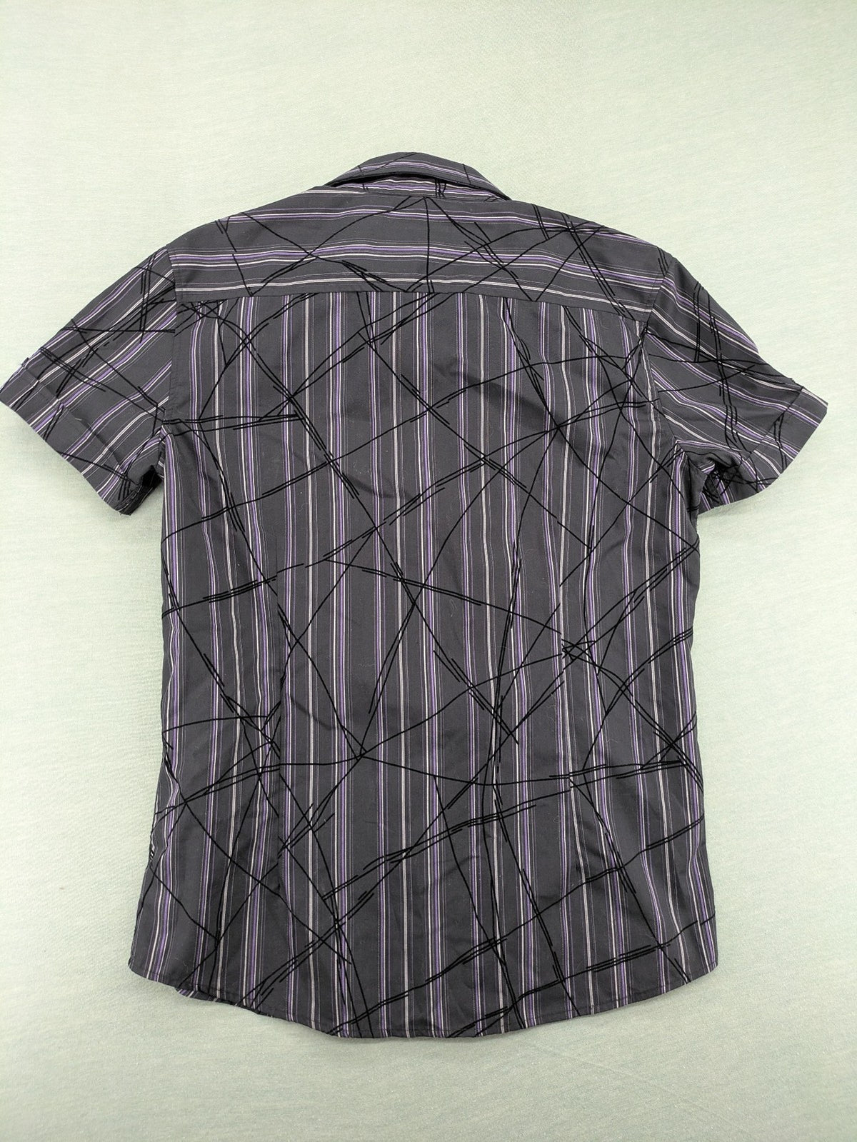 Clockhouse short-sleeve shirt grey purple striped with abstract black graphic pattern and purple collar.