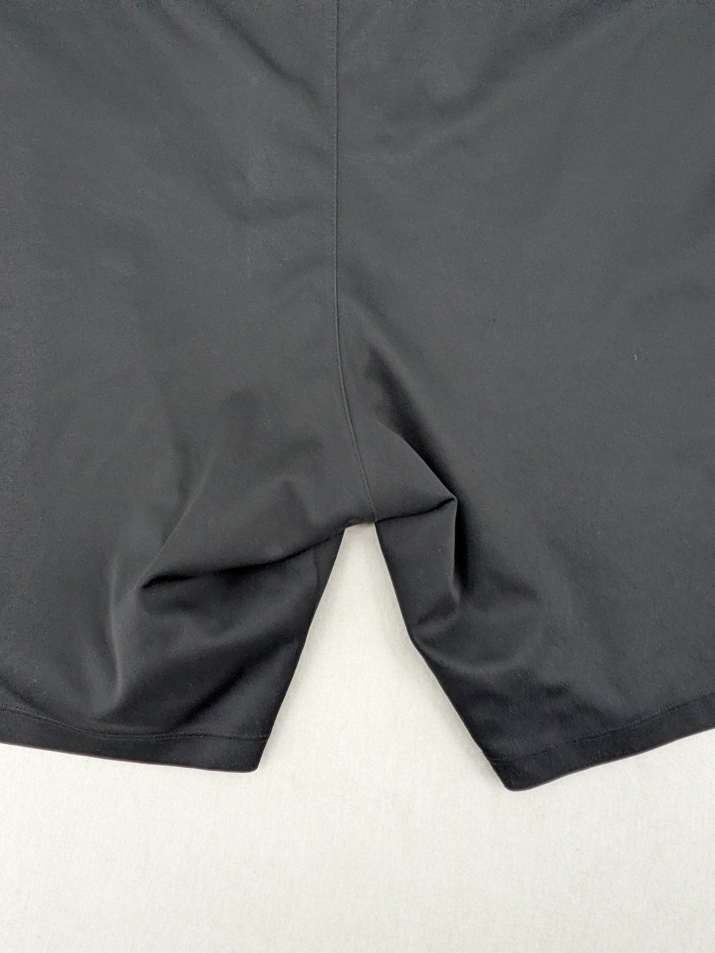 Bayer black training shorts with red side stripes, embroidered team crest and Castore logo.