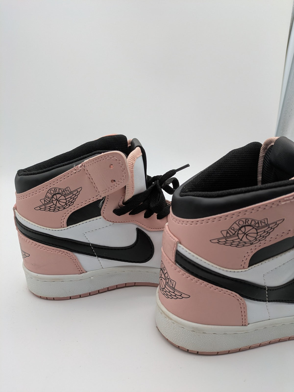 Nike Air Jordan high-top sneakers multi with Wings logo, Jumpman detail, and perforated toe.