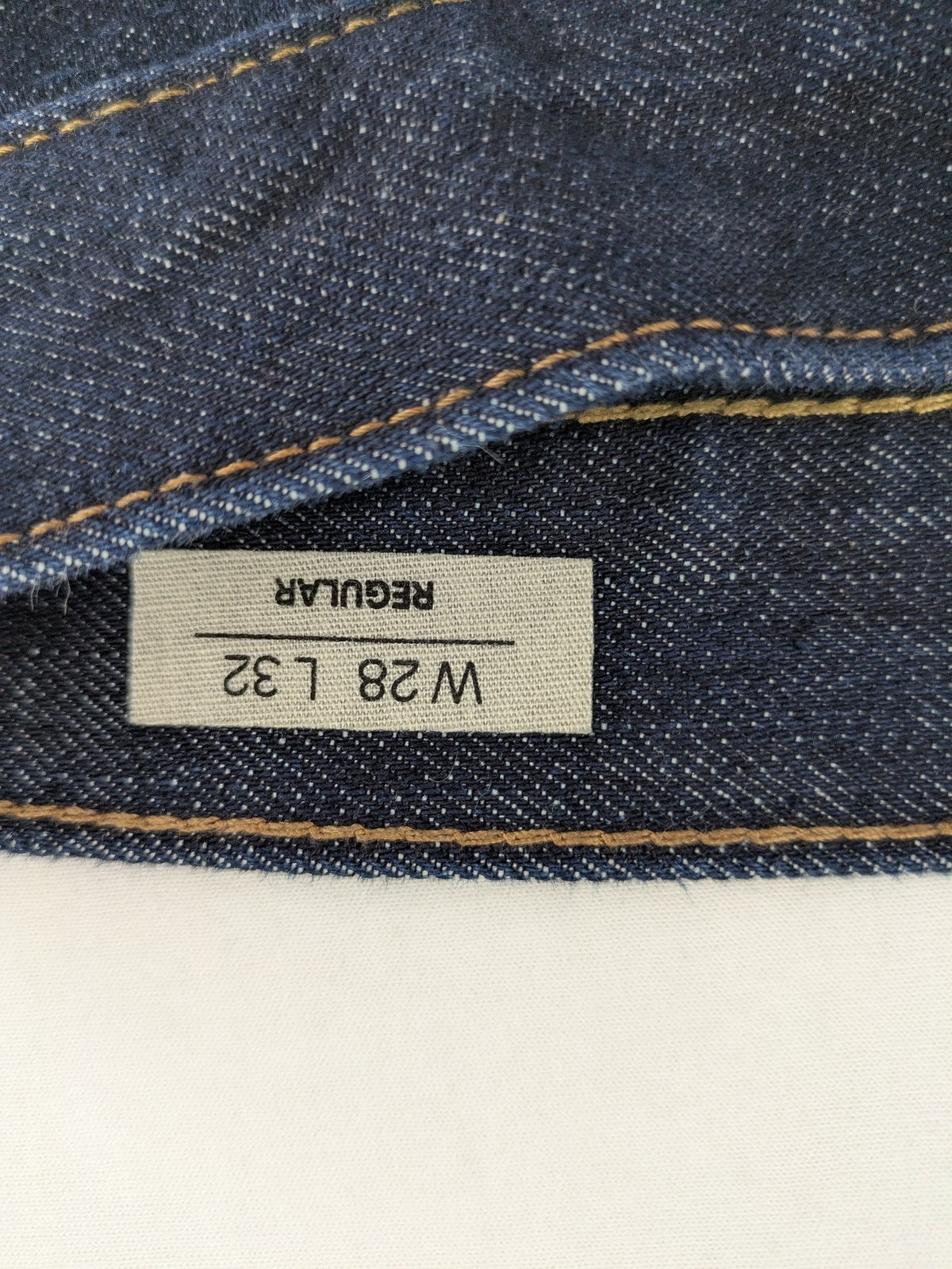 C&A blue straight jeans W28 L32 with 5-pocket design and contrasting orange stitching.