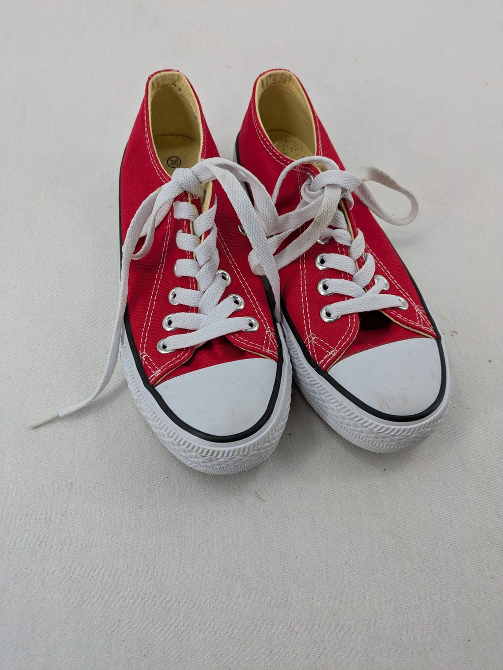 Sneaker low-top canvas sneakers red upper with white laces and rubber sole