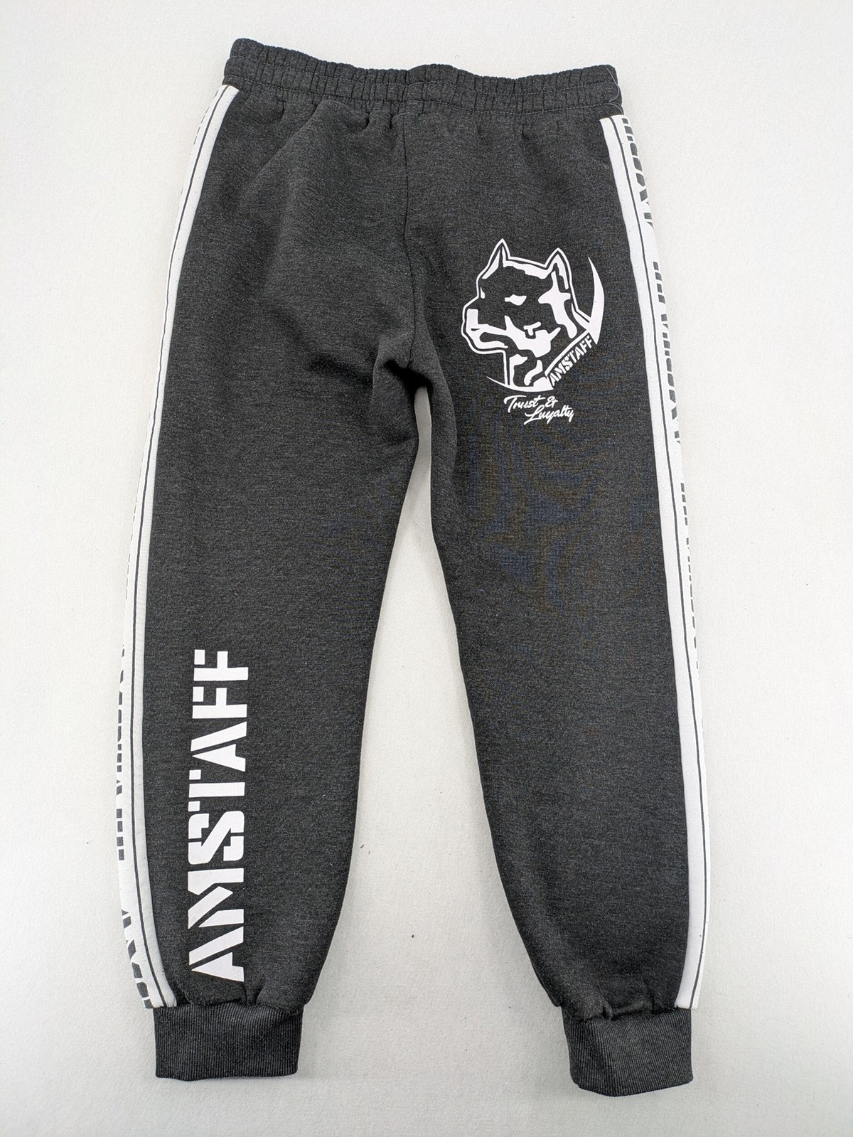 Amstaff grey sweatpants with large dog logo and "Trust & Loyalty" text.