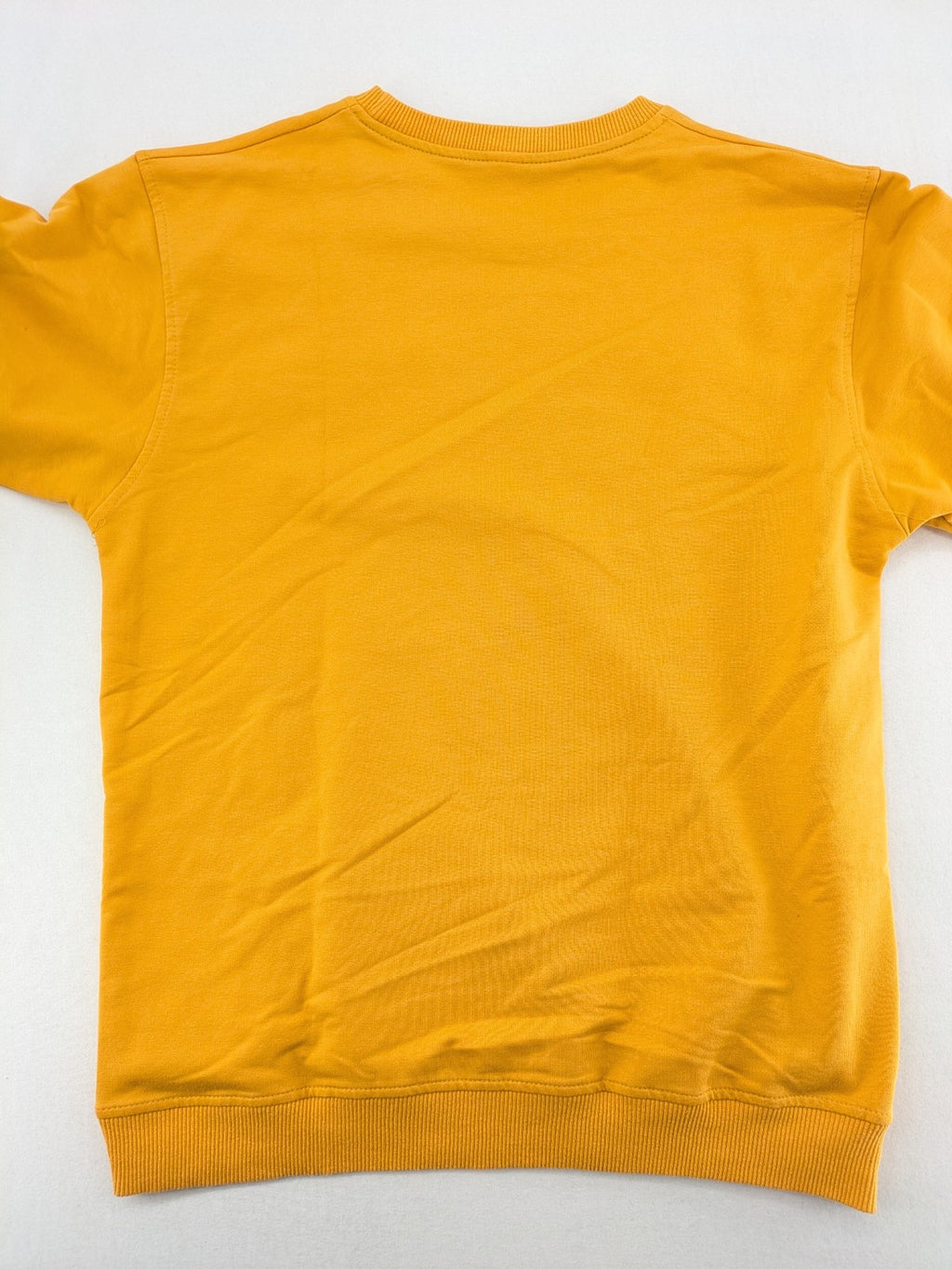 Columbia yellow turtle neck jumper with iconic logo, ribbed cuffs, and soft cotton material.