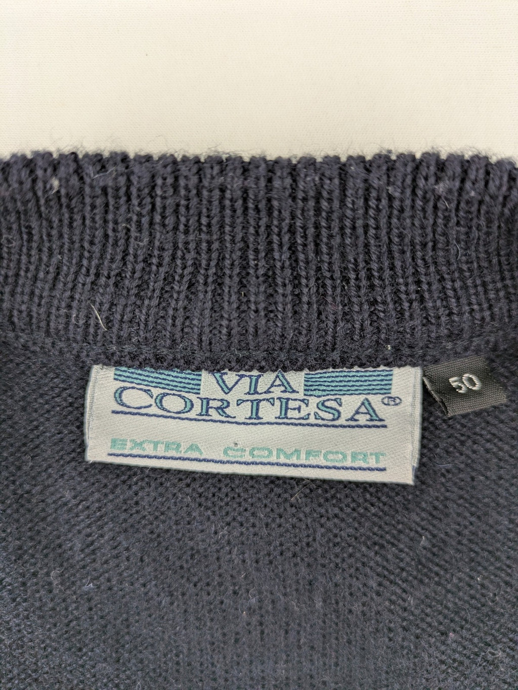 Via Cortesa gold turtle neck jumper with structured pattern and V-neck design.