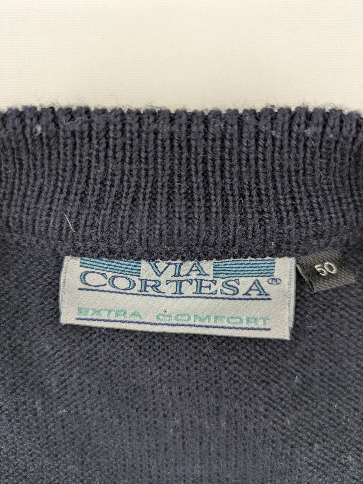Via Cortesa gold turtle neck jumper with structured pattern and V-neck design.