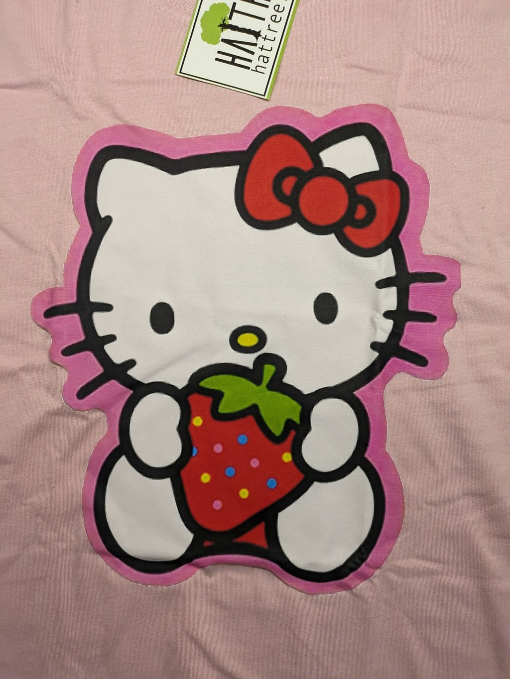 Hello Kitty multi T-shirt pink with large strawberry graphic and short sleeves.