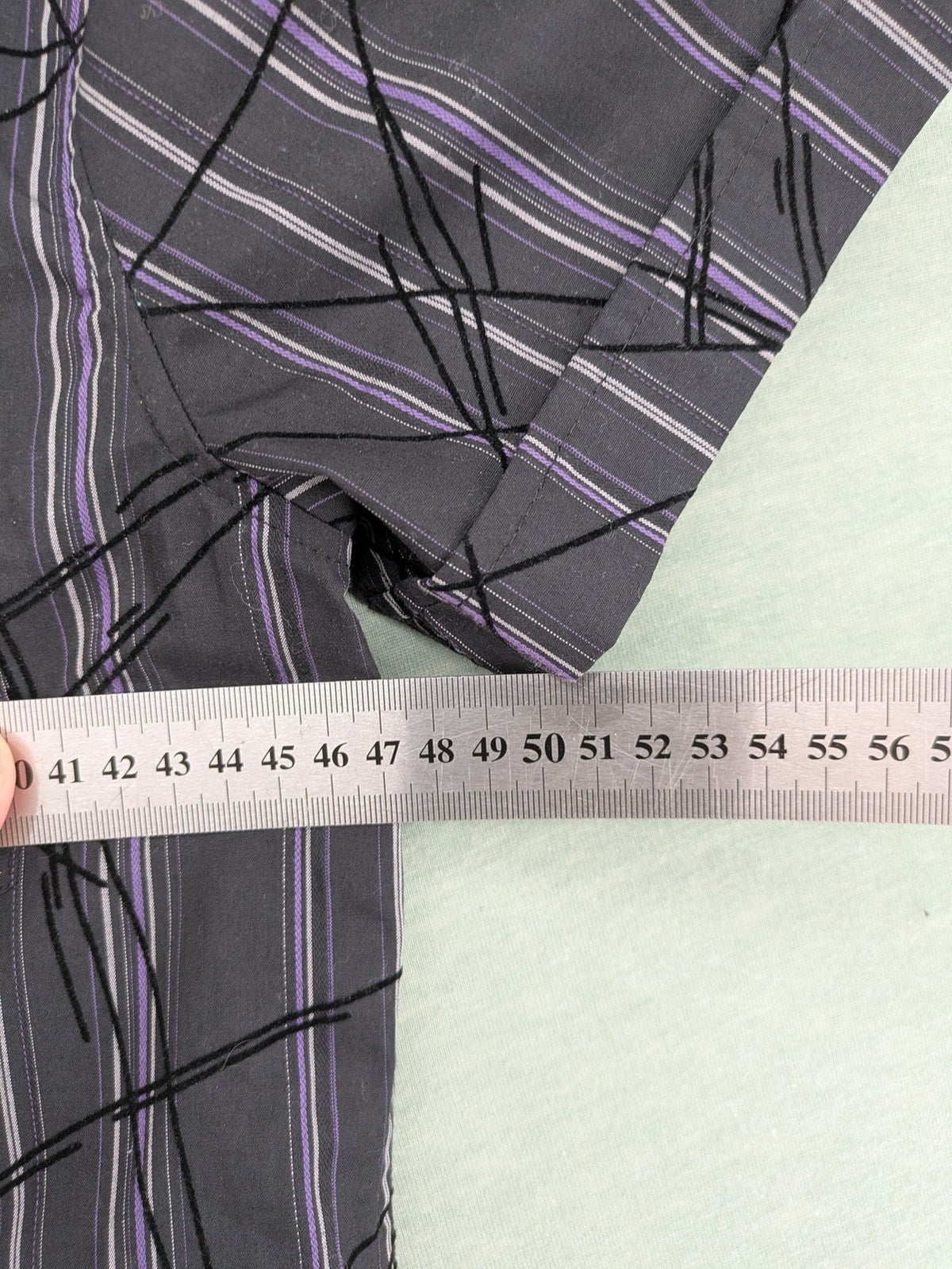 Clockhouse short-sleeve shirt grey purple striped with abstract black graphic pattern and purple collar.