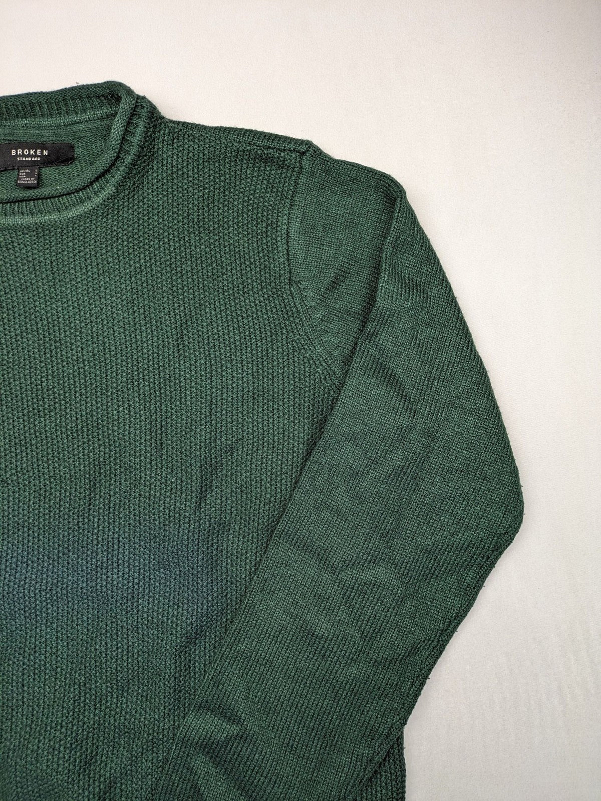 Broken Standard turtle neck jumper green waffle knit texture with classic round neckline.