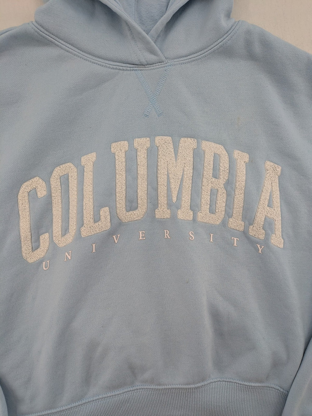 Columbia University blue hoodie with large "Columbia University" text on chest.