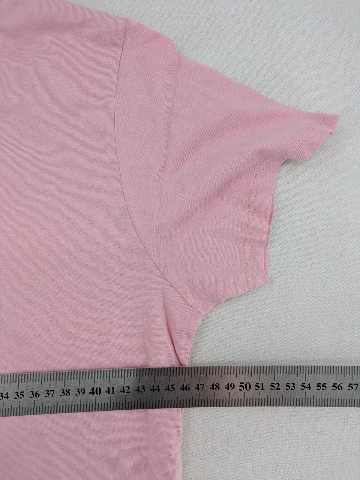 Pokémon pink t-shirt featuring large Jigglypuff graphic and comfortable fit.