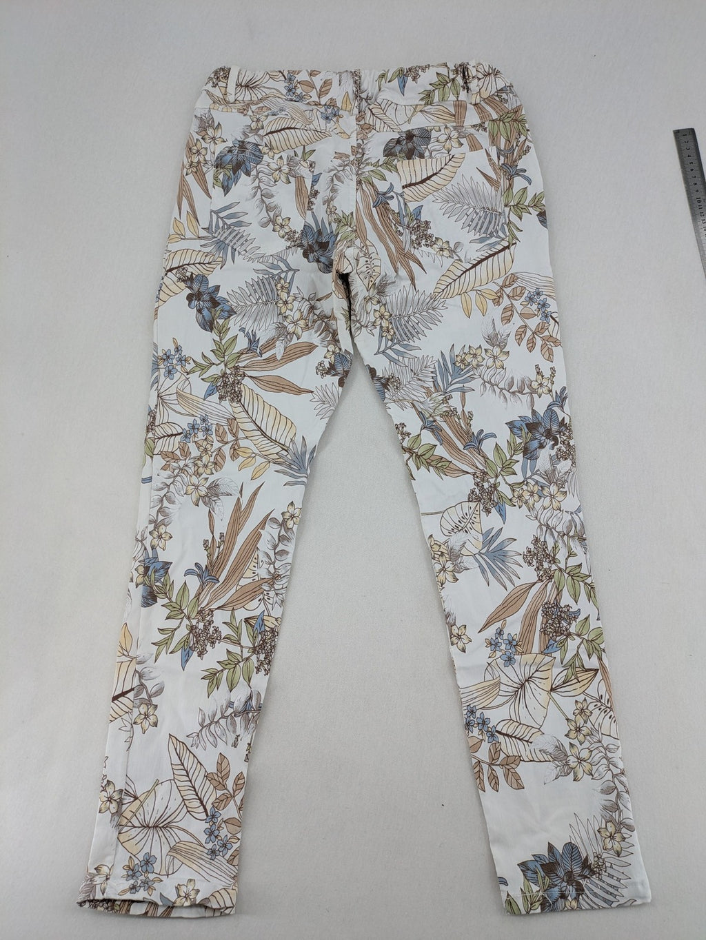 Made in Italy multi pants tropical floral pattern cotton-viscose blend on white background.