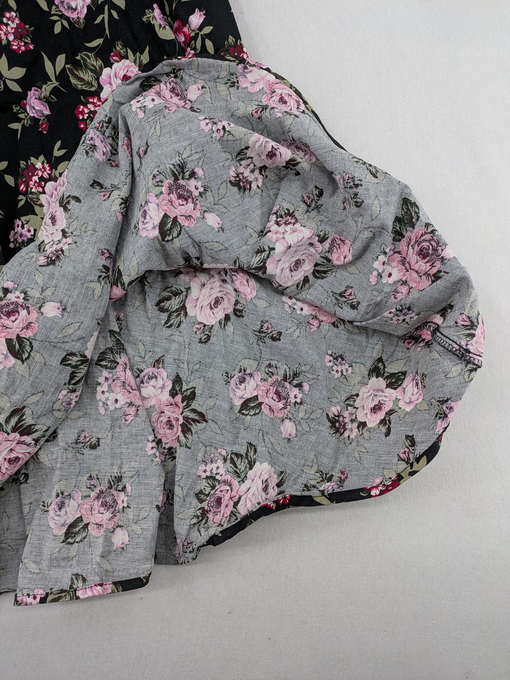 M/L black A-line dress with floral skirt and lace trim details.