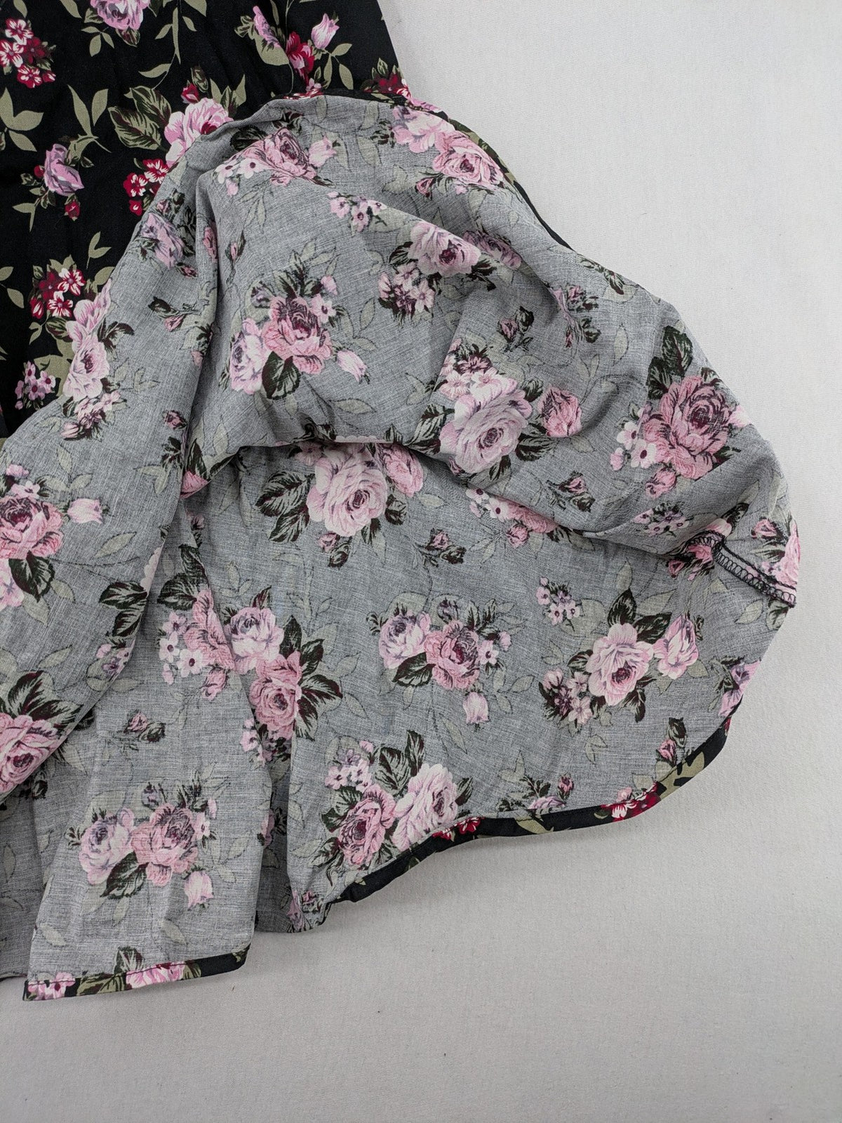 M/L black A-line dress with floral skirt and lace trim details.