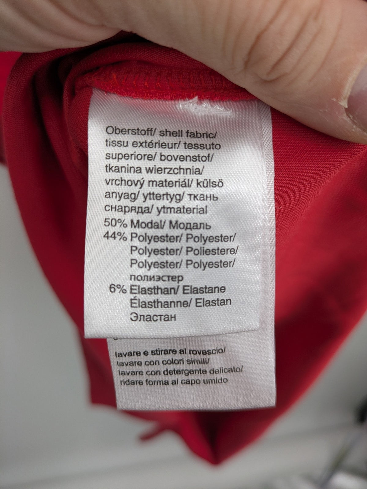 H&M red A-line dress with stand collar, 3/4 sleeves, and side pockets in stretchy jersey.