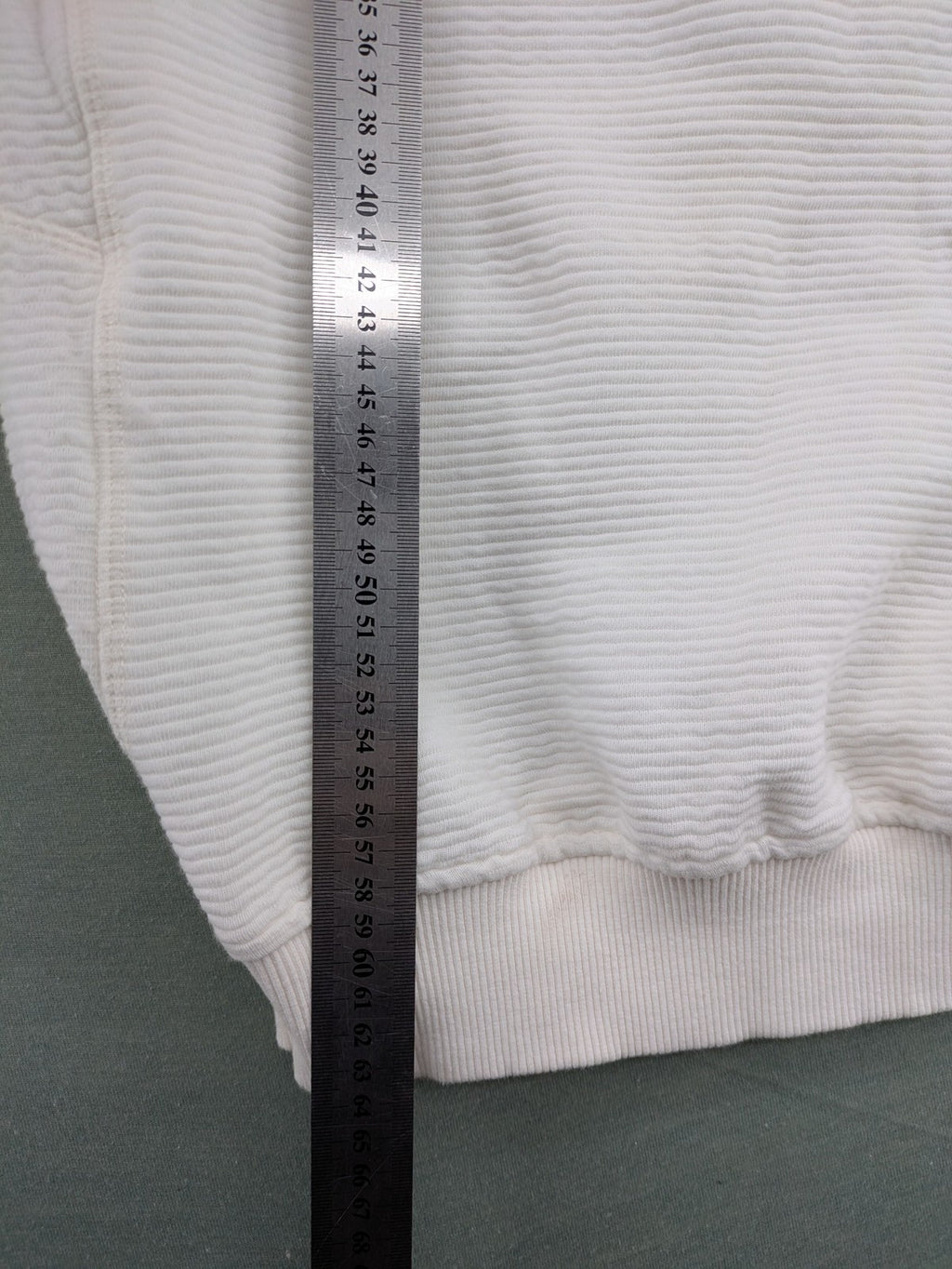 CHASIN' grey and white turtle neck jumper with horizontal ribbed texture and logo patch.