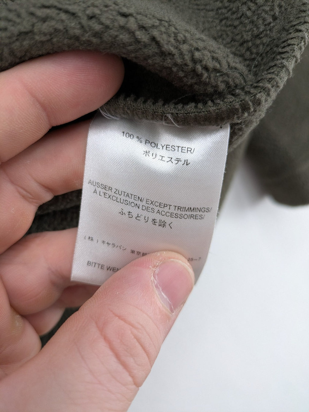 Jack Wolfskin khaki turtle neck jumper with quarter zip and embroidered paw logo.