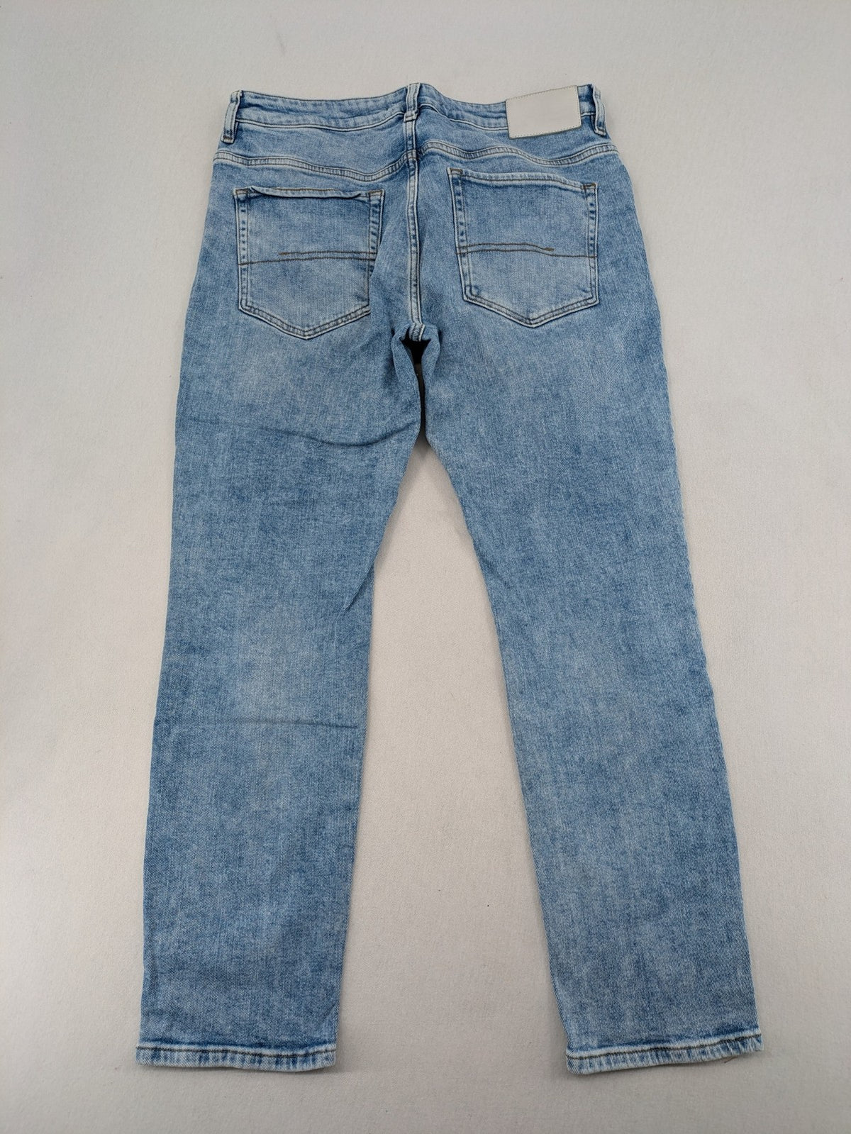 Oskar blue slim fit jeans with classic 5-pocket design and light wash.