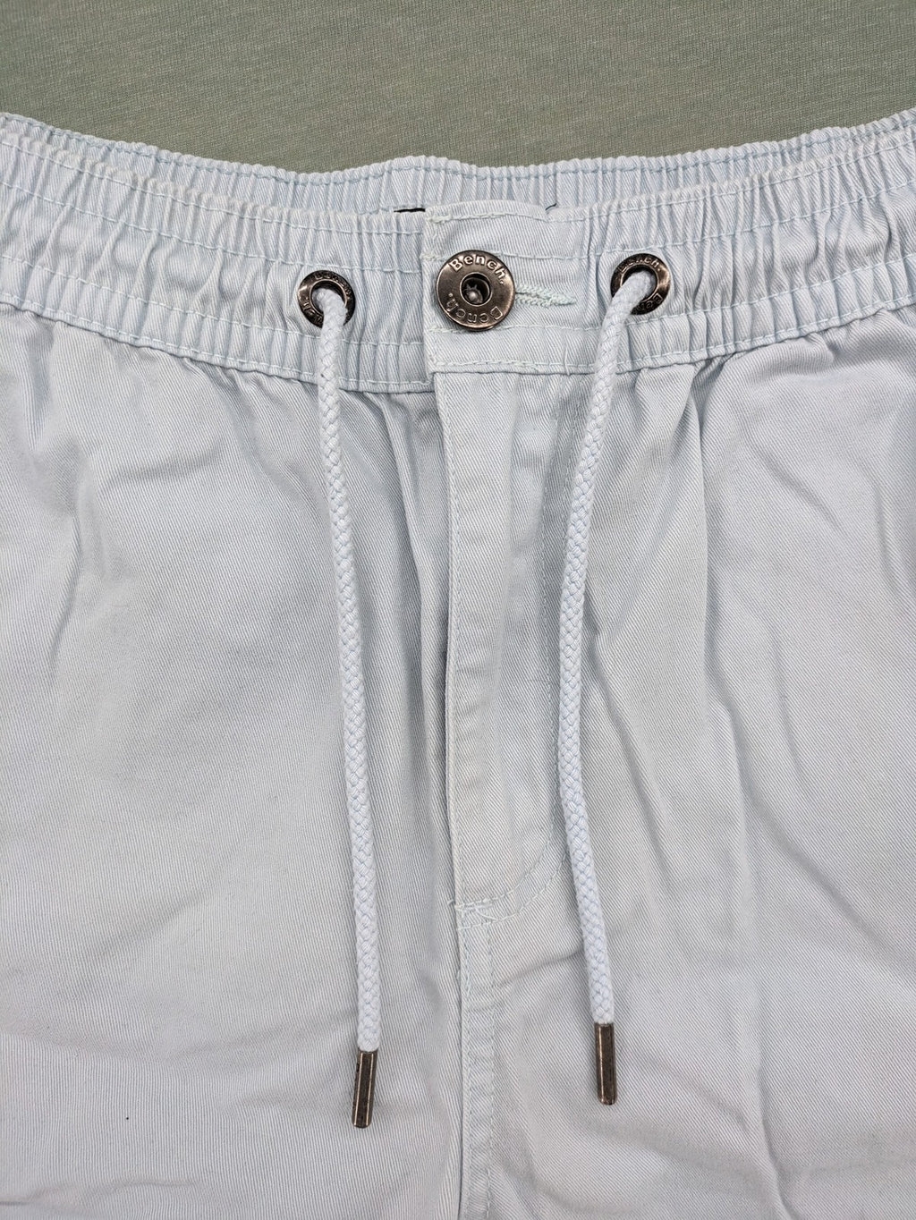 Bench blue shorts with elastic waistband, drawstring, and multiple pockets.