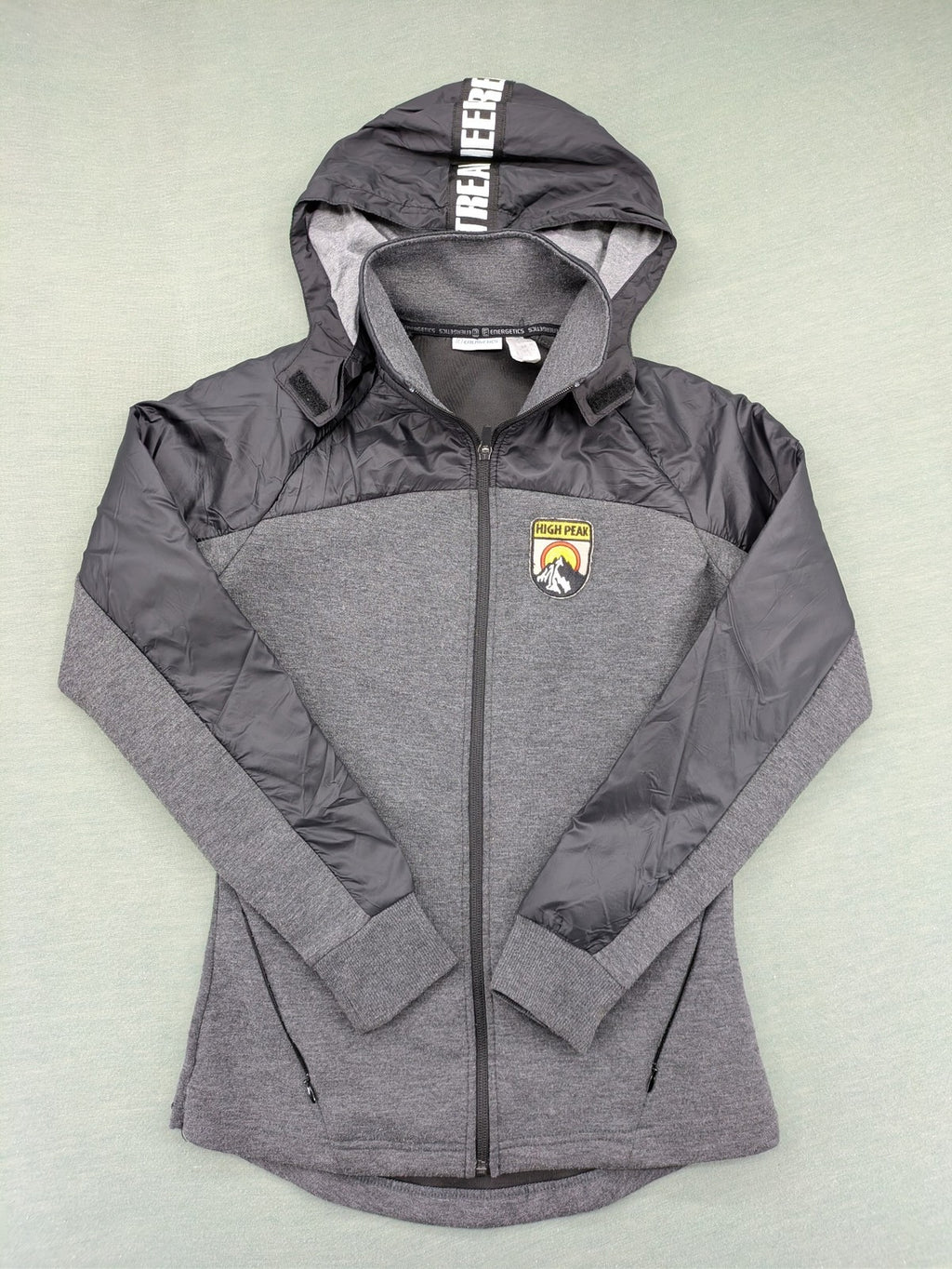 Energetics hybrid jacket black grey with High Peak patch and zip-up design.