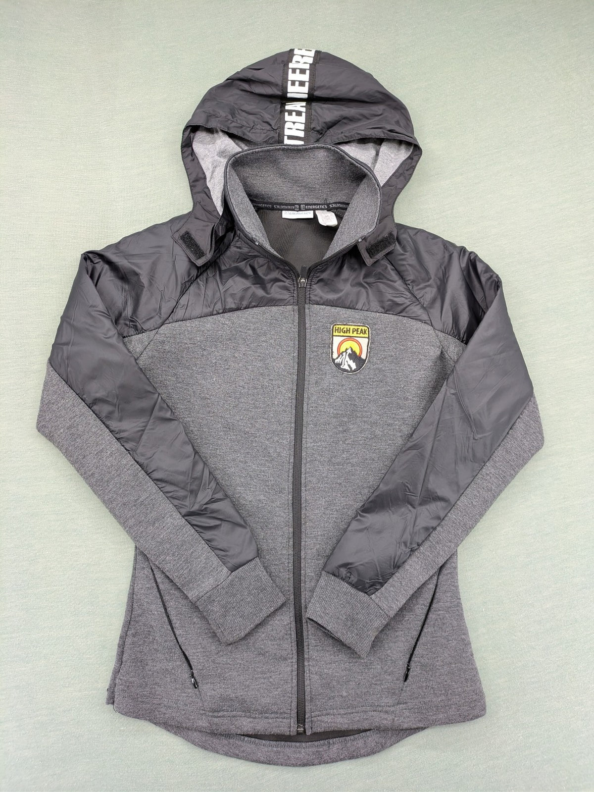 Energetics hybrid jacket black grey with High Peak patch and zip-up design.