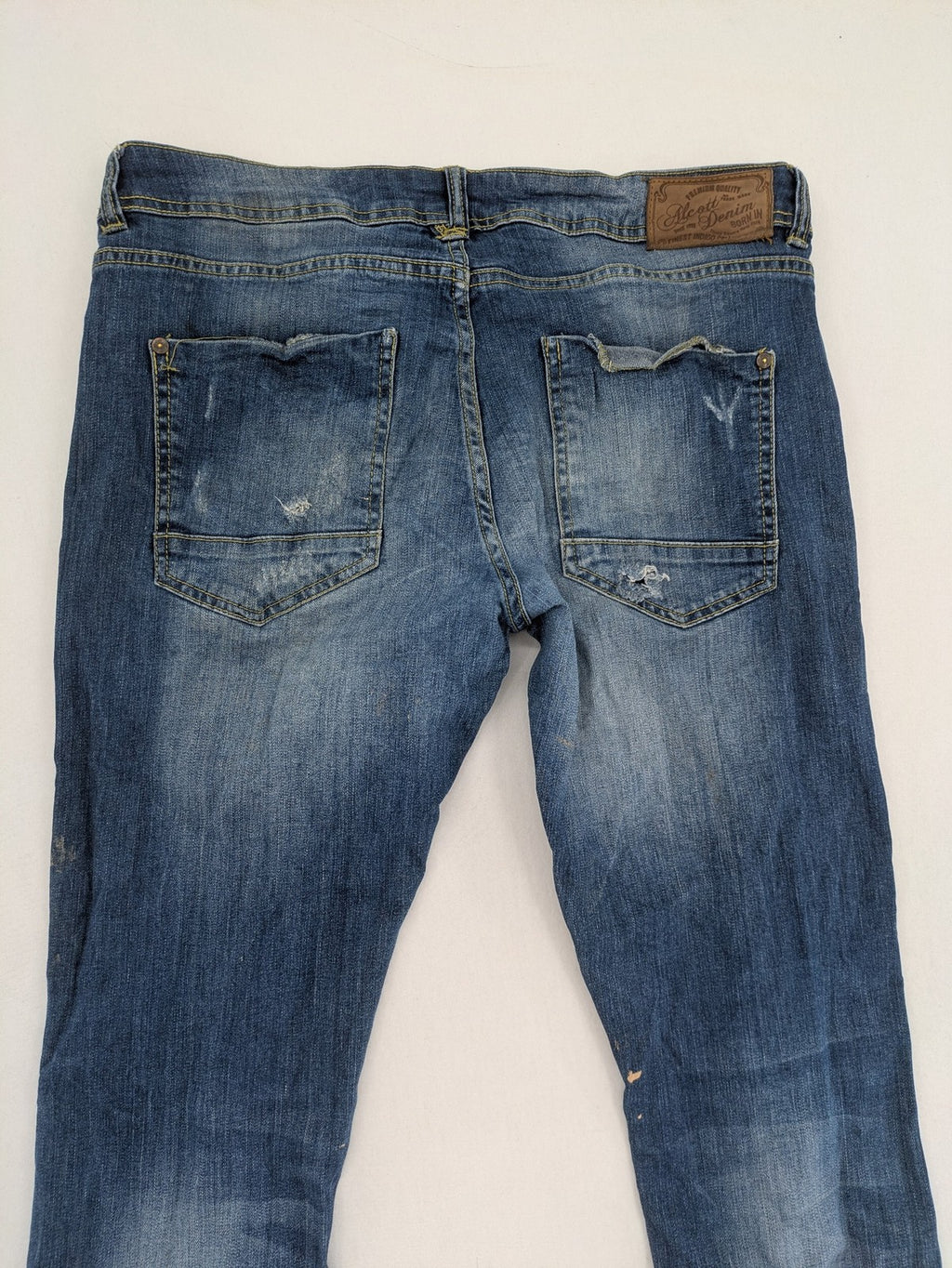 alcott skinny fit jeans blue distressed with button fly and strong wash details