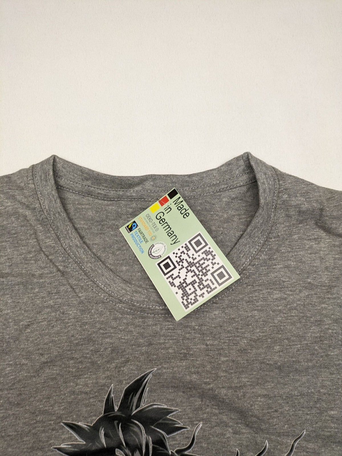 Dragon Ball Z grey t-shirt featuring Son Goku graphic print and "Go" Kanji symbol.