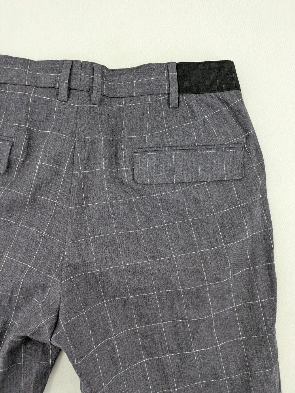 MNG Man grey plaid pants with rolled hem and stretch performance material.