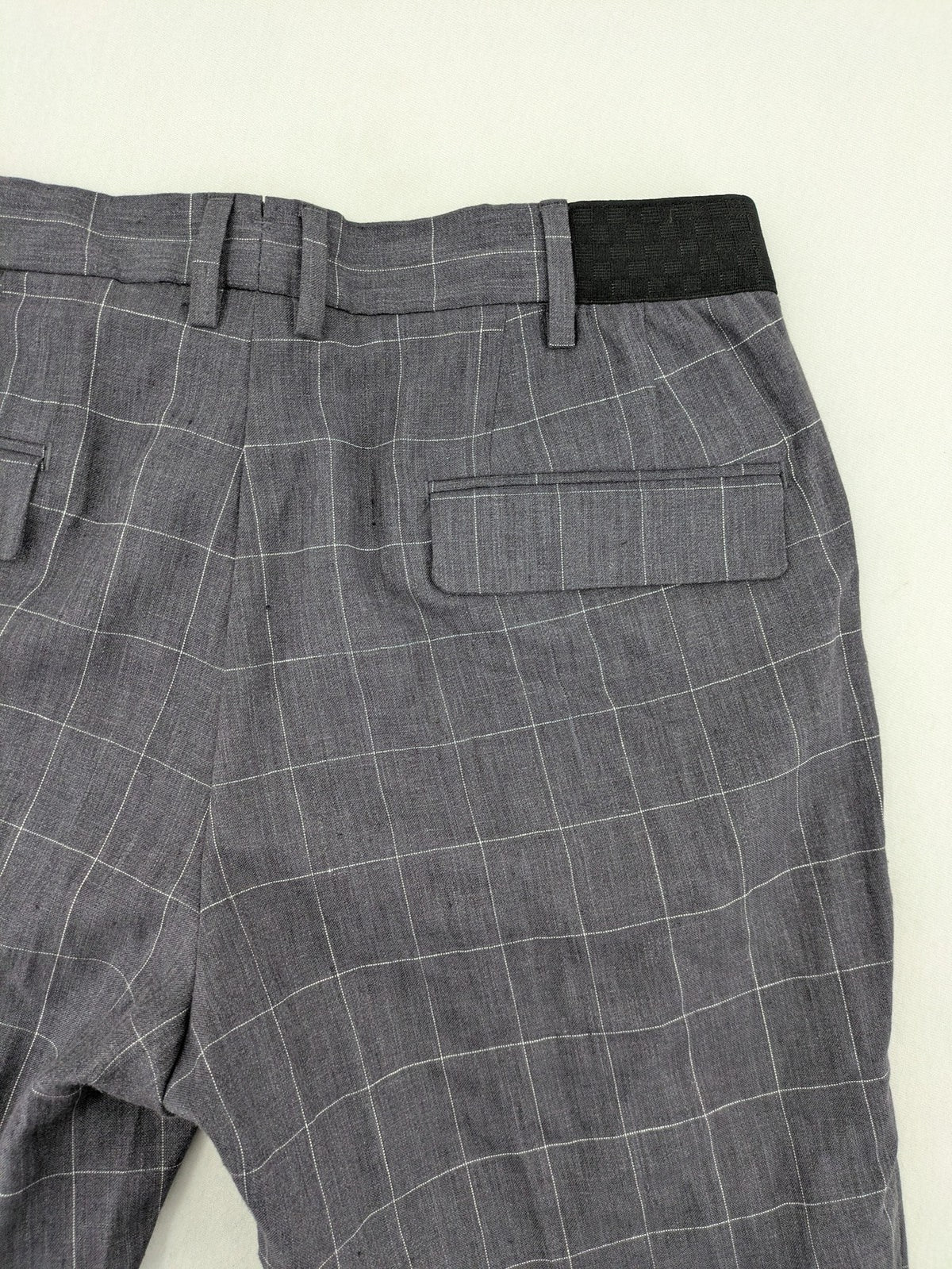 MNG Man grey plaid pants with rolled hem and stretch performance material.